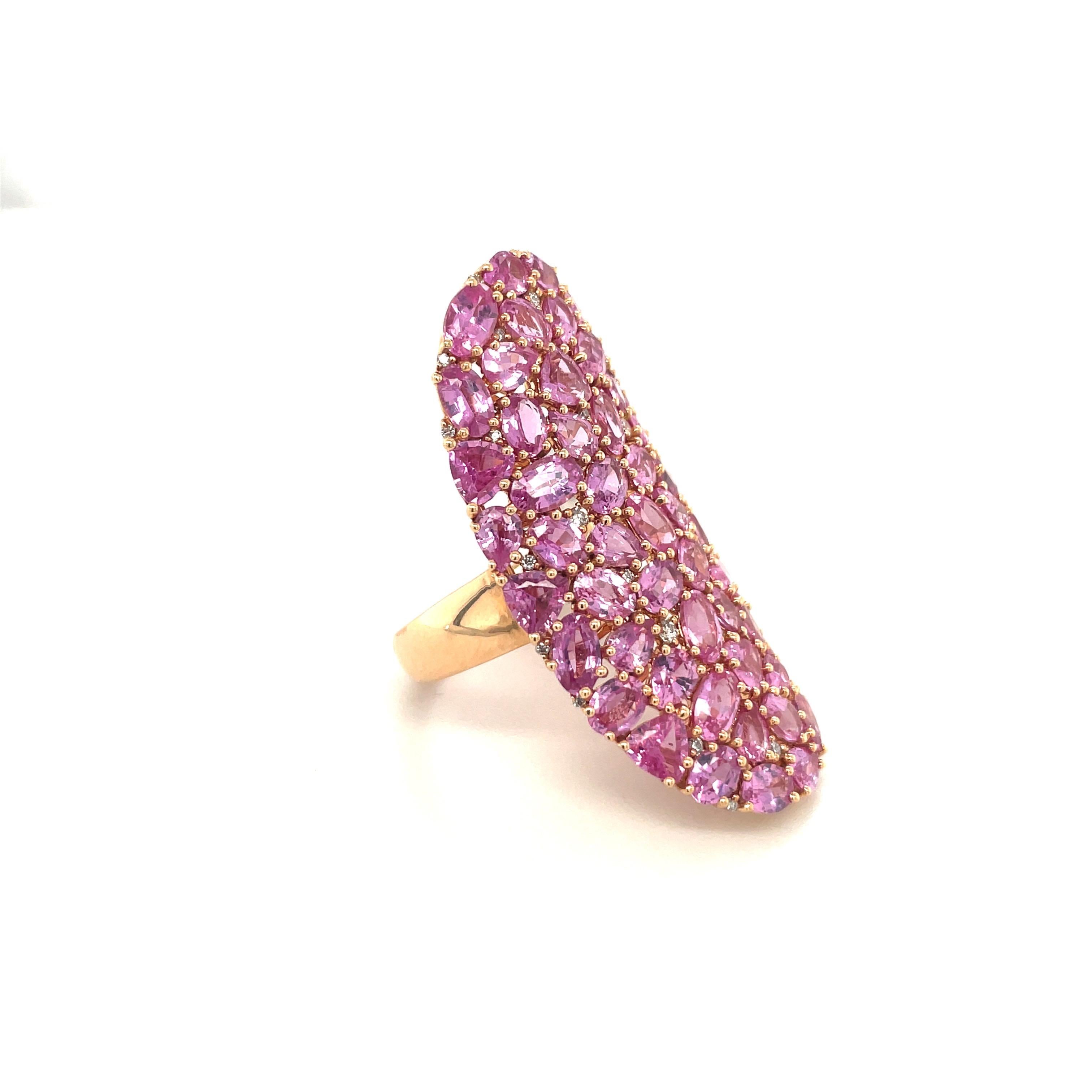 This magnificent 18 karat oval rose gold ring is beautifully set with 11.31 carats of oval pink sapphires. Round white diamonds 0.17 carats are sprinkled throughout. The oval ring measures 1.5