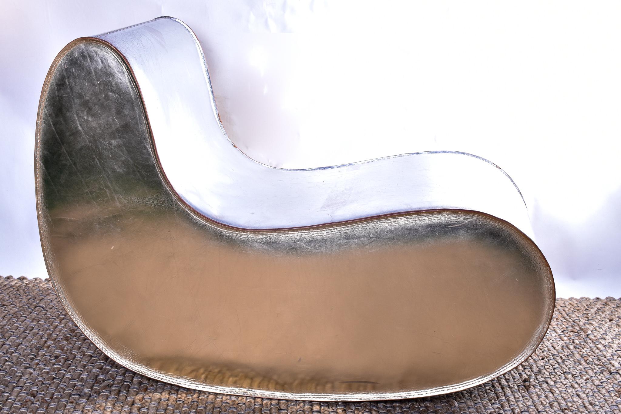 An incredibly funky multi use Sutra chair by Gregorio Spini for Italian manufacturer Kundalini, when placed in various assemblages vertically or horizontally, forms a soft rocking chair, sitting island, ottoman or side table. Stitched silver leather