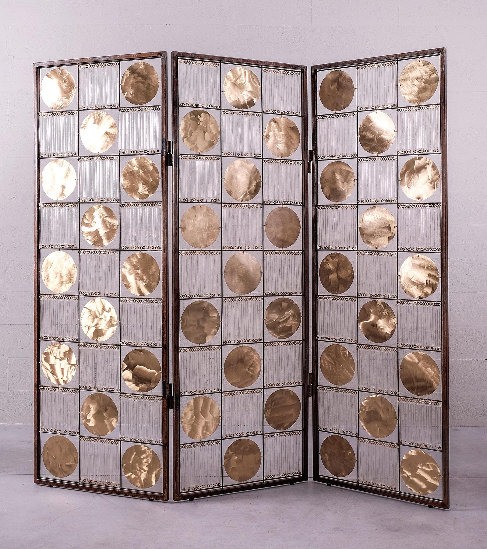 Sutra Love Screen by Valentina Giovando
Dimensions: W 193.5 x D 3 x H 186 cm.
Materials: Iron, Brass, Glass, Metal.  

Valentina Giovando, Lives and works in Sarzana, in Liguria, and for over 20 years she dedicated herself to the production of a new