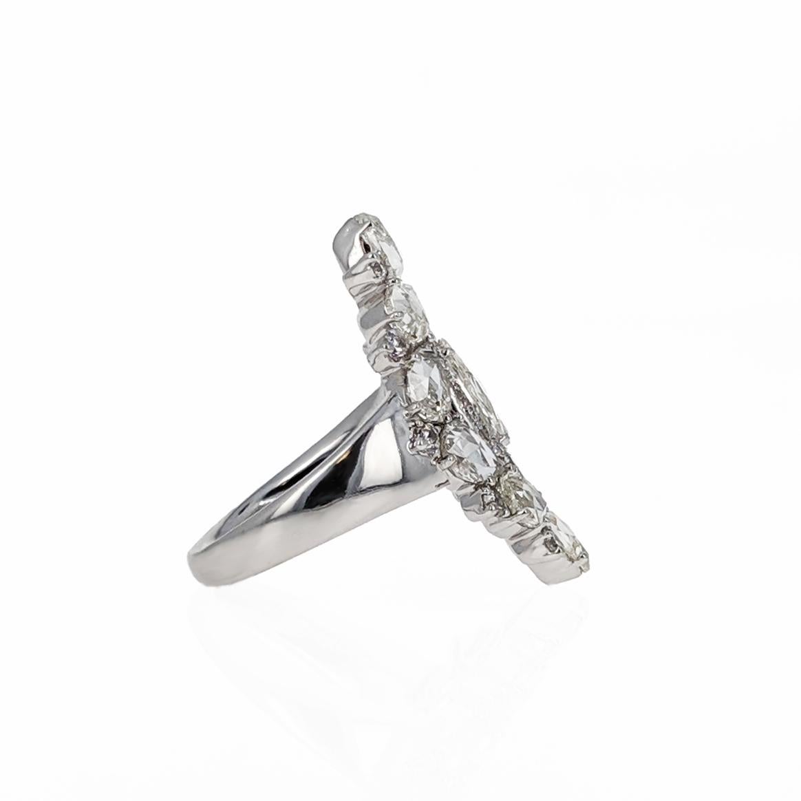Navette in shape, set with rose-cut and single-cut diamonds weighing approximately 6 carats. Mounted in 18 karat white gold. Signed Sutra. 
Size 7.

It's ethereal look with its subdued yet elegant rose-cuts and wide symmetrical design create a
