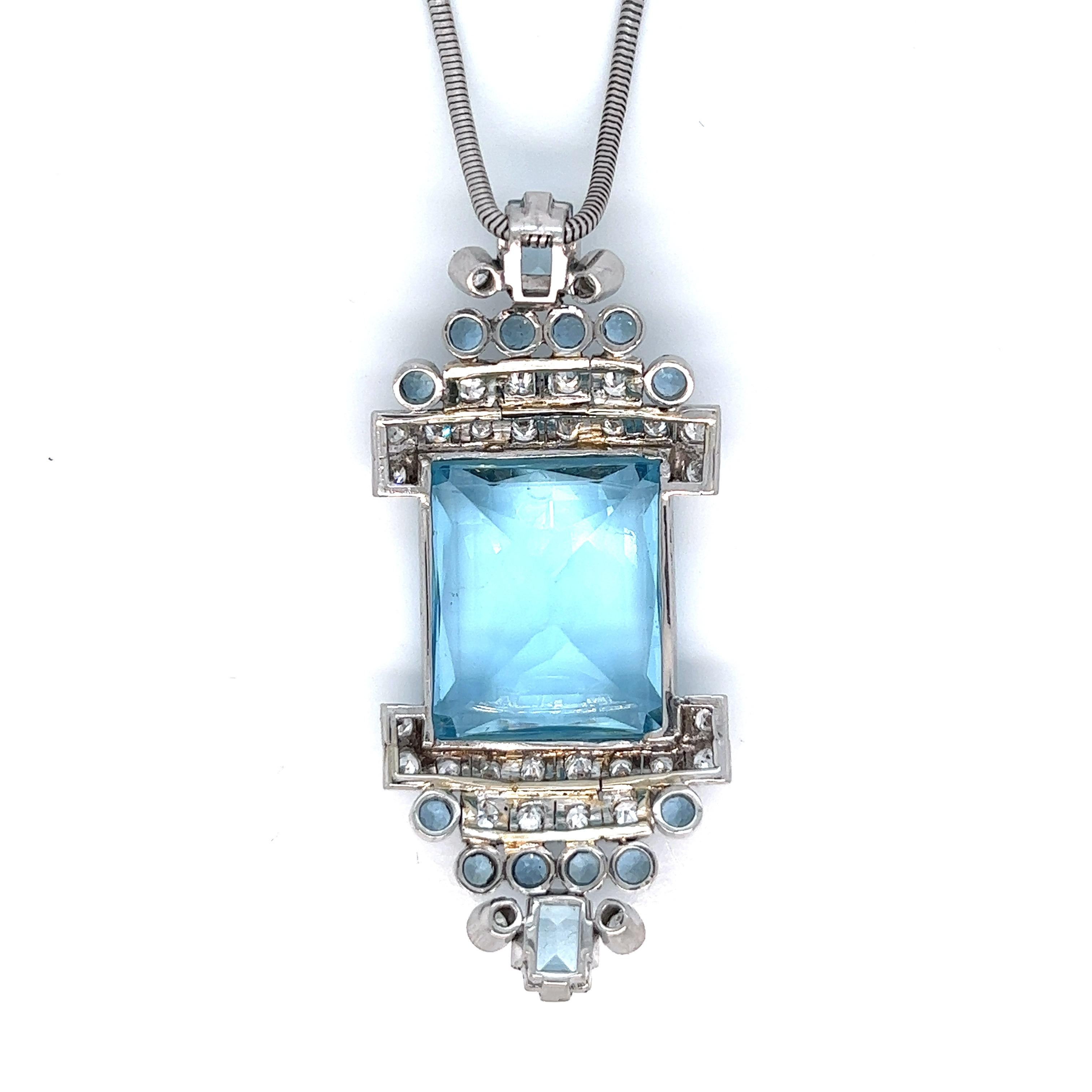 Suzanne Belperron aquamarine diamond necklace 

French-cut aquamarine (21.7 x 18.8 x 12.5 mm) of approximately 35-40 carats, round-cut diamonds of approximately 2.5 carats, round- and rectangular-cut smaller aquamarines of approximately 5 carats, 18