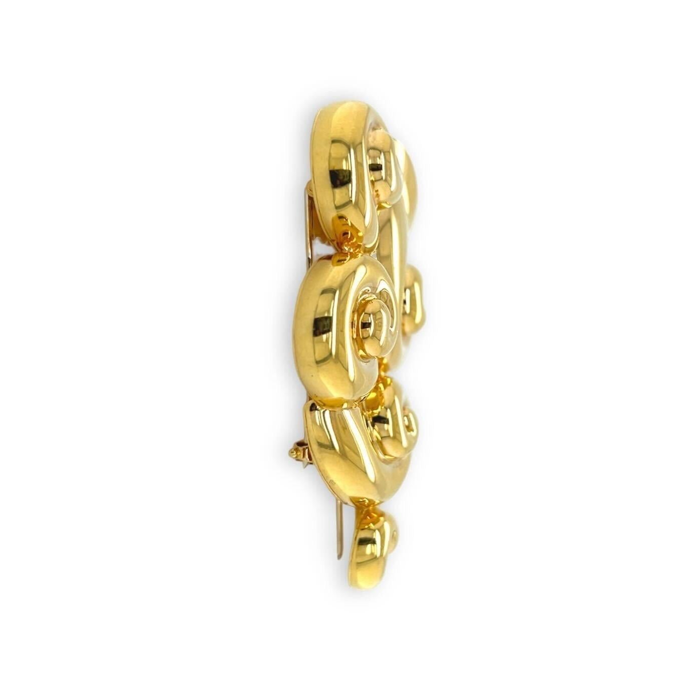 An 18 karat yellow gold brooch, Suzanne Belperron, France.  The “Cloud” brooch designed as five (5) descending fluted scrolls.  Length approximately 3 inches.  Gross weight approximately 43.60 grams.  Signed St. N. Herz Belperron, France and hand