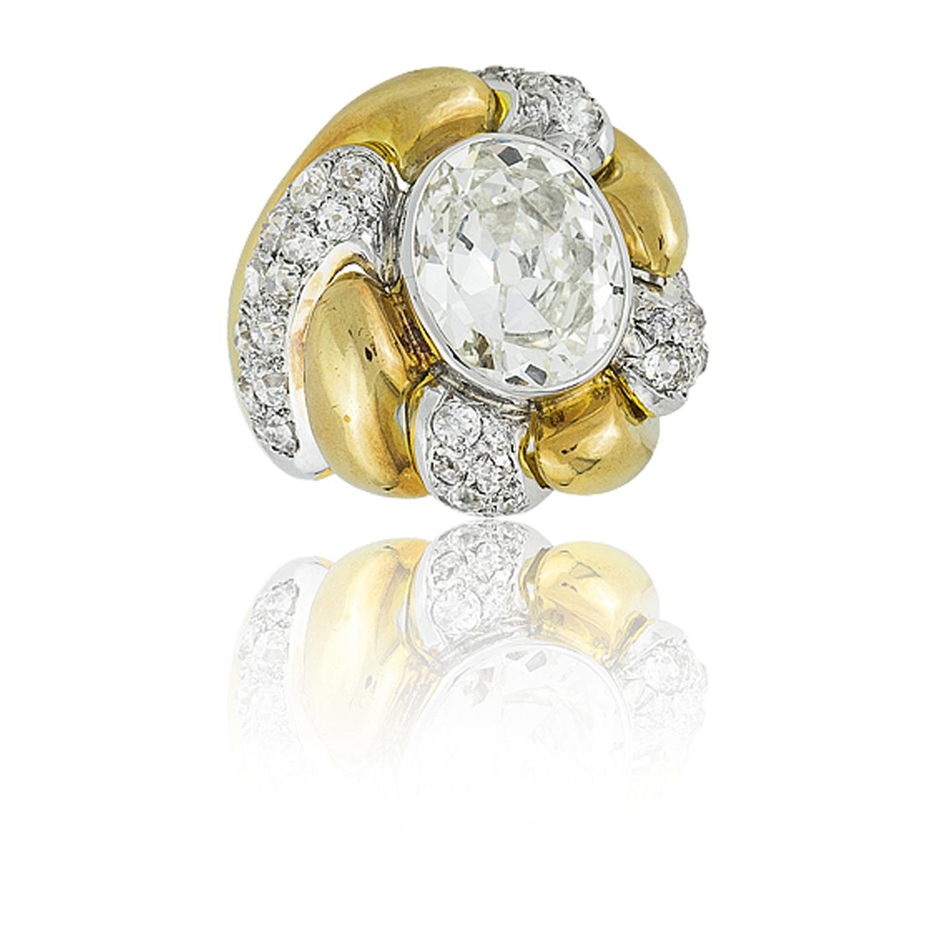 Suzanne Belperron Platinum 18K Yellow Gold & Diamond “Tourbillon” Ring; Oval Cut Diamond  approx 5.40ct ;  Poinçon for Groene et Darde; French, Ca 1942
see: Suzanne Belperron by Sylvie Raulet / Olivier Baroin, pg 292