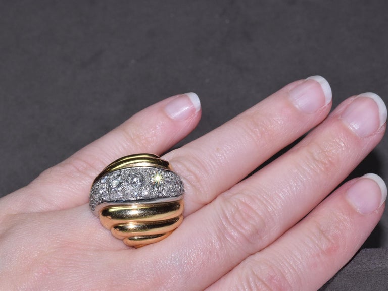 Suzanne Belperron Yellow Gold Bombe Diamond Wave Ring, circa 1940s

This wearable and chic ring is by one of the most preeminent jewelers of the 20th century - Suzanne Belperron. Her style and design was her signature. This ring is of bombe form