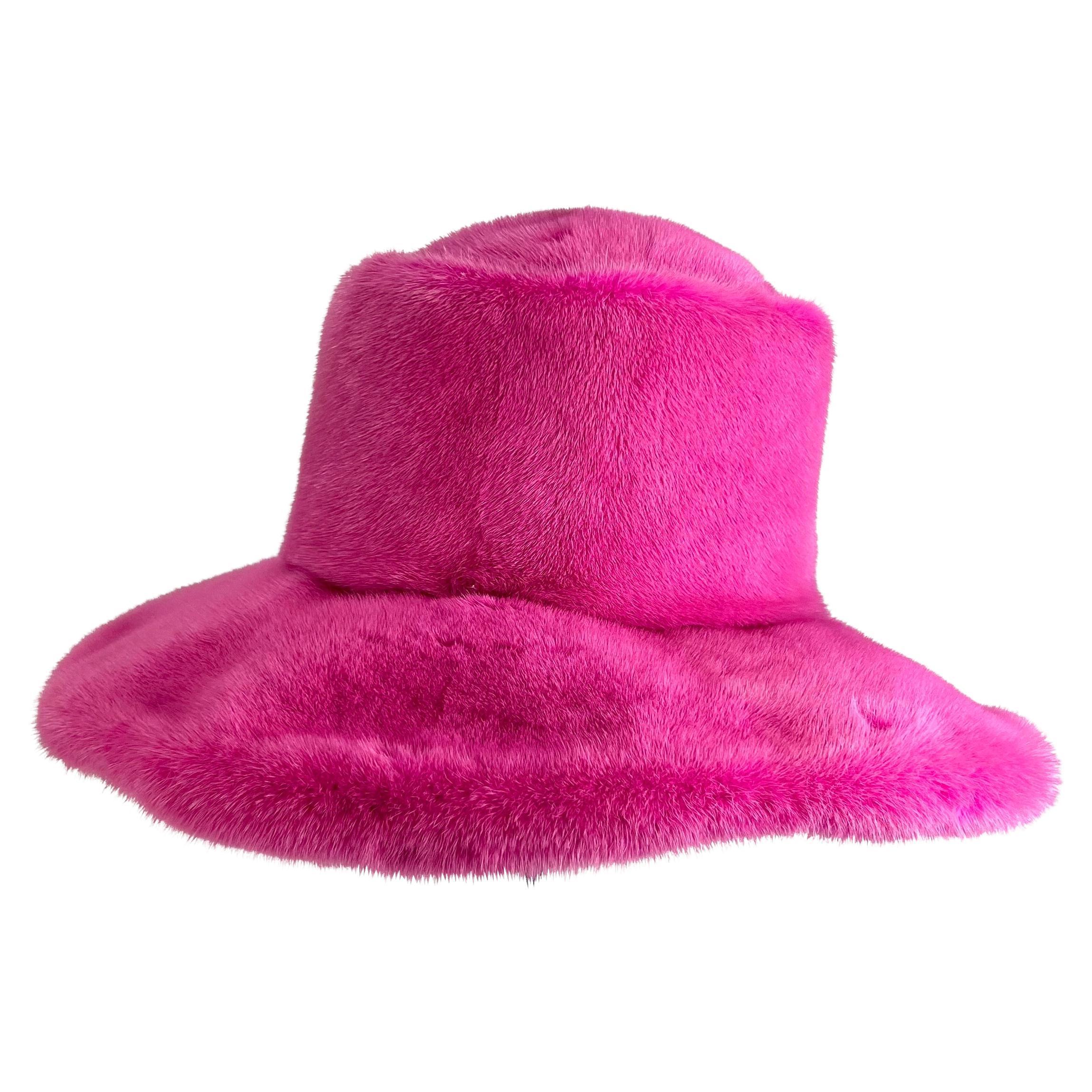 Presenting an incredible hot pink Suzanne Couture Millinery mink bucket hat. This oversized hat is constructed entirely of bright pink mink fur and is the perfect one-of-a-kind piece to add to any wardrobe.

Approximate Measurements: 
Height: