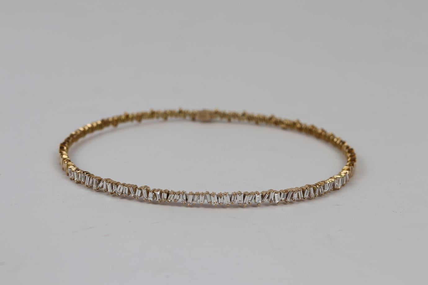 Suzanne Kalan 18 karat rose gold baguette diamond choker. 18K rose gold. Hallmarked: 18 KT. Total Item Weight: 28 g. Gemstone: Diamond. Carat Weight: 3.00. Stone Count: 54. Stone Shape: Baguette. Comes with box. Chain Length: 13 in. Very good