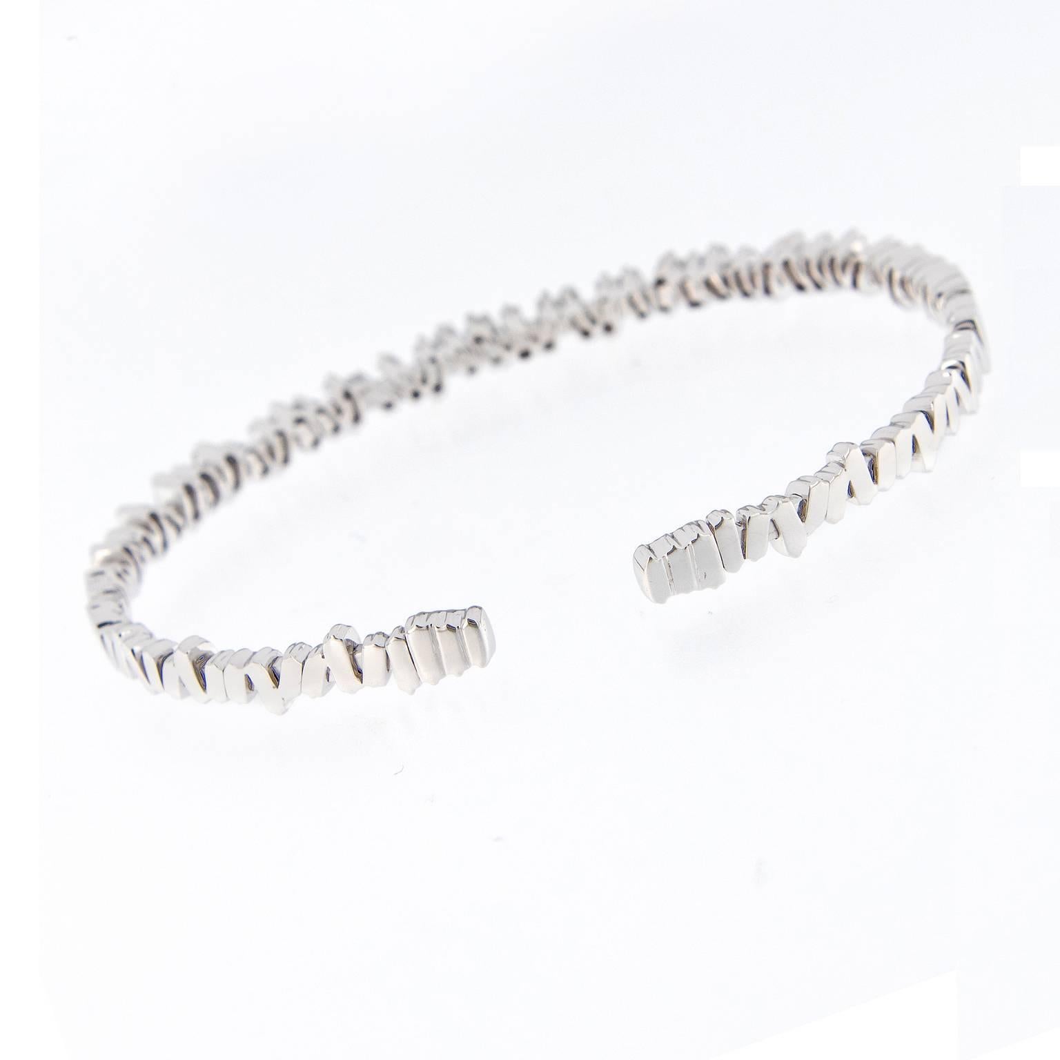 Suzanne Kalan says the best thing about her designs is that they look just as good with jeans as they do with an evening dress. This stunning flexible cuff bracelet is expertly crafted in 18k white gold with baguette diamonds. Weighs 12.3 grams.