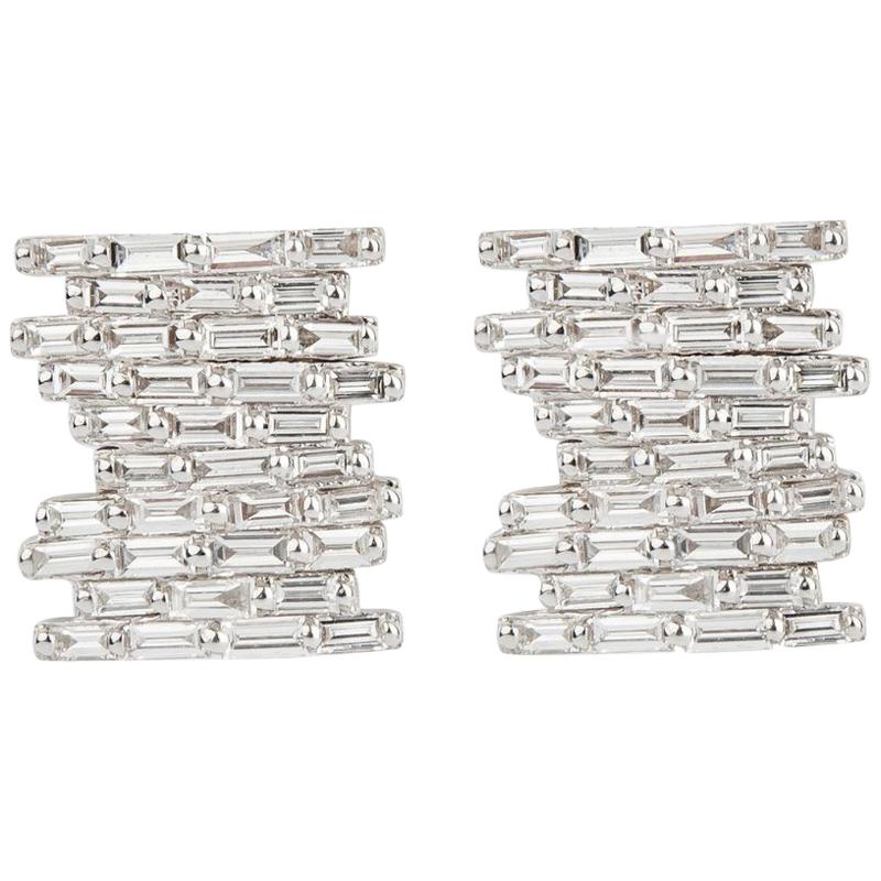 Intricately set baguette diamonds in a stacked tile pattern add just the right amount of edge to these classic diamond studs.


18K white gold with 1.02ct white diamond baguettes
0.50” long
