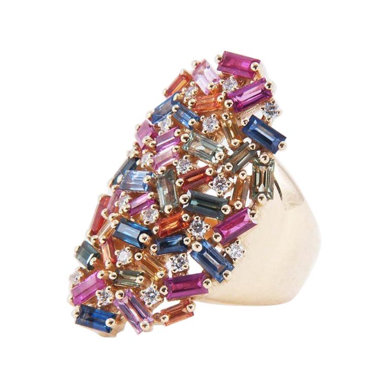 Rainbow-colored sapphire baguettes and round diamonds are scattered across this dramatic yellow gold shield band. Wear alone as a statement piece.

18K yellow gold ring (14.8 GR)
5.16 carats of multi-hued sapphire baguettes
0.30 carats round
