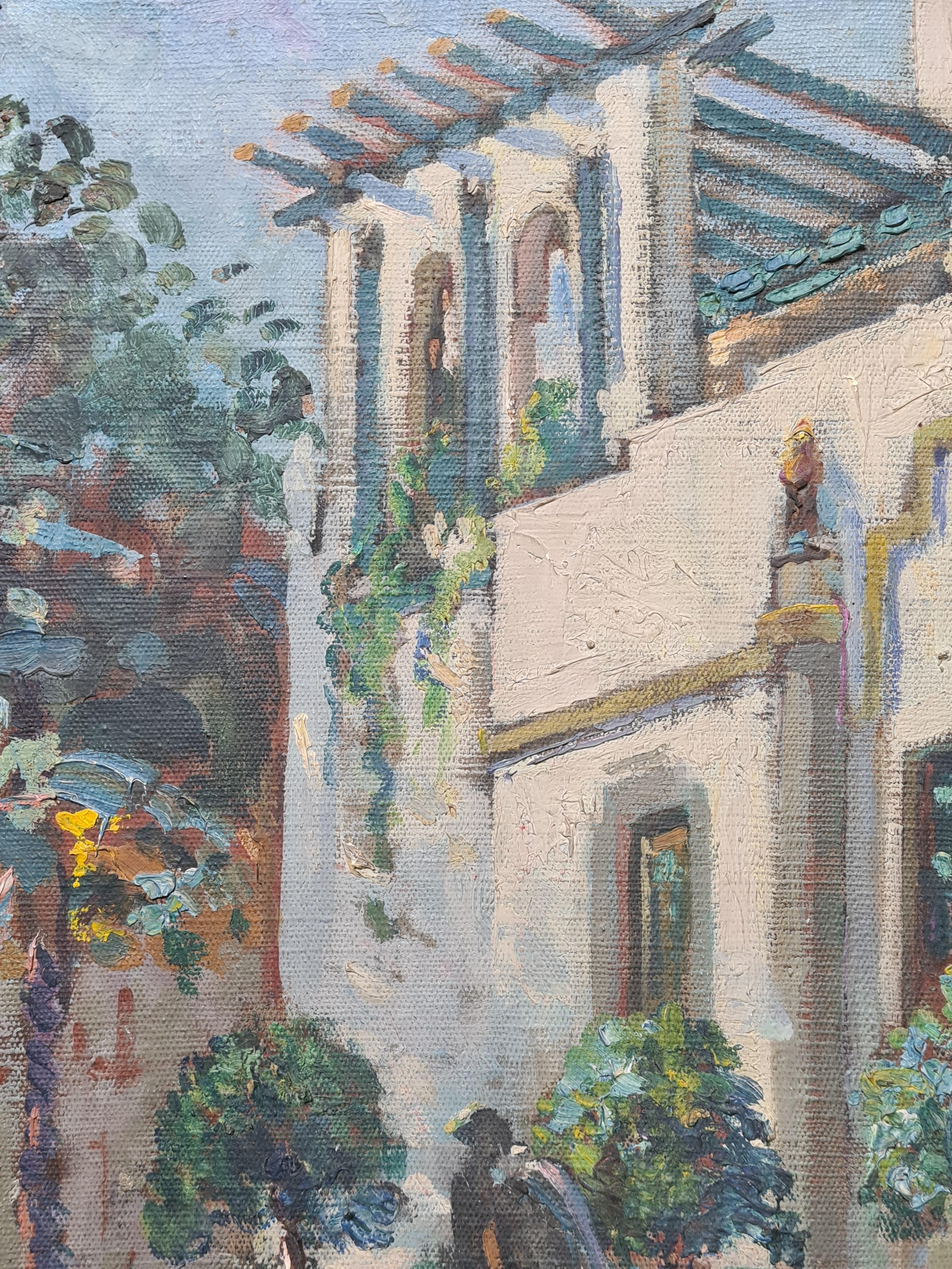 Vista al óleo sobre lienzo de principios del siglo XX de una villa y un jardín en St Tropez, en el sur de Francia, de la artista francesa Suzanne Minier. El cuadro está firmado abajo a la izquierda. Hay un sello comercial parisino en la parte