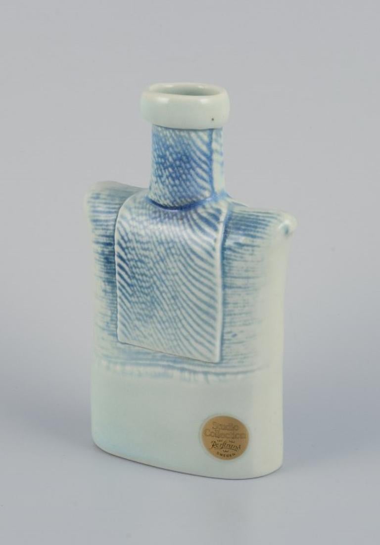 Suzanne Öhlén (born 1953) for Rörstrand, Sweden. 
Porcelain vase with glaze in blue tones.
1980s.
Marked.
In perfect condition.
First factory quality.
Dimensions: H 15.0 cm x D 9.2 cm.