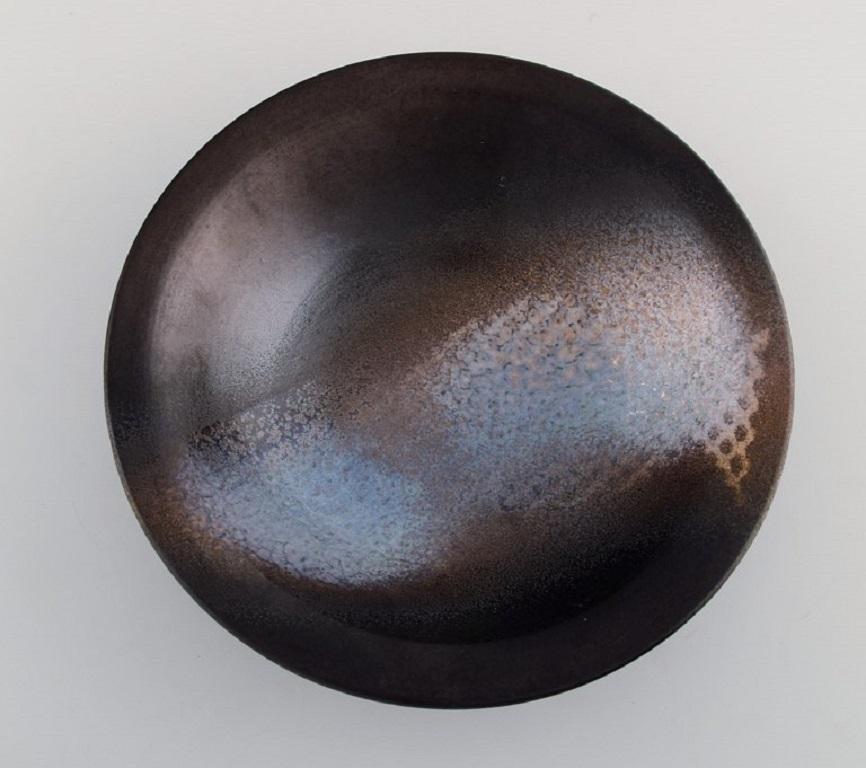 Suzanne Ramie (1905-1974) for Atelier Madoura. Unique bowl in glazed stoneware. Mid-20th century.
Measures: 22 x 5.7 cm.
In excellent condition.
Stamped.

Suzanne Ramié (1905-1974) is best known as the founder of the Madoura pottery workshop in