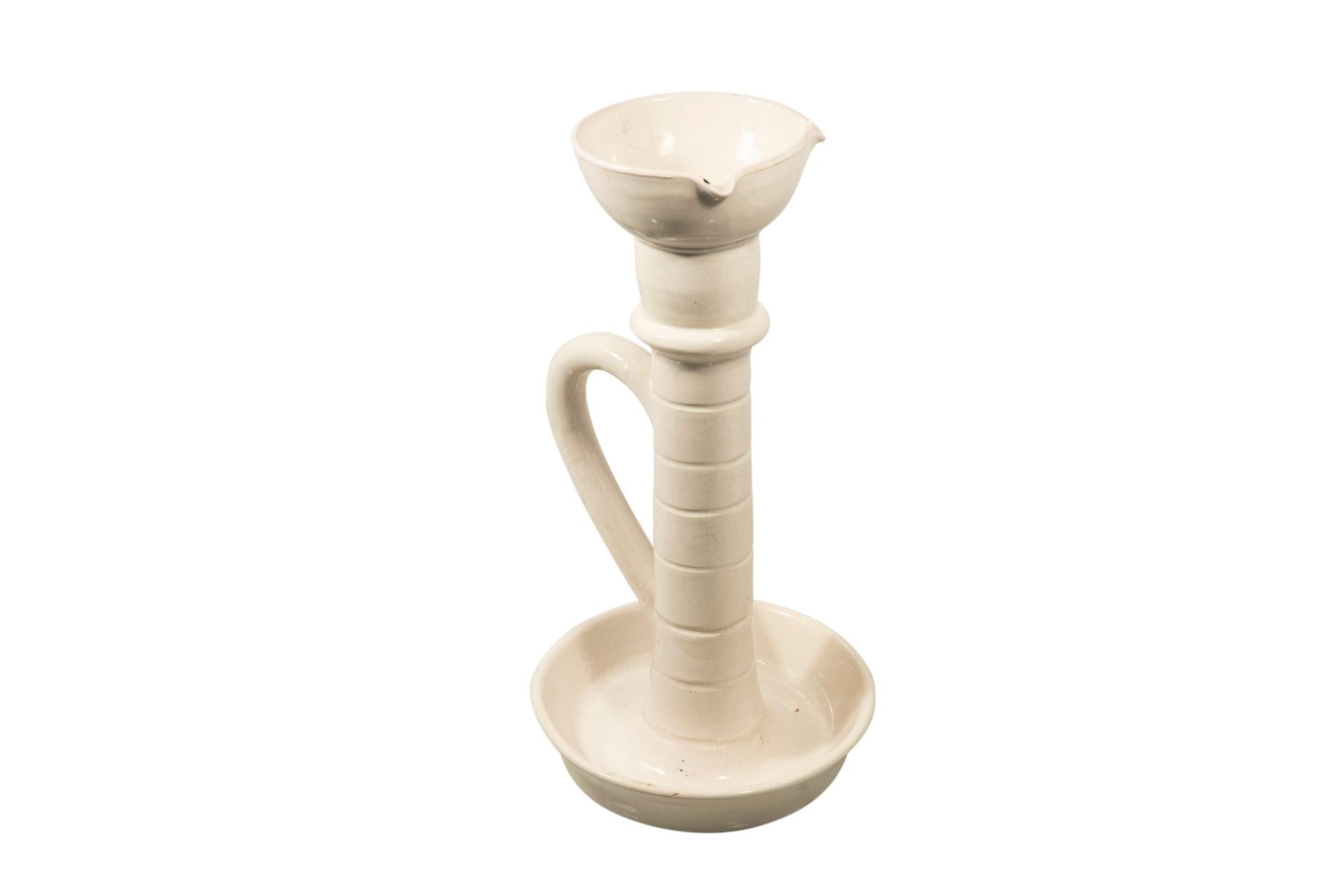 Suzanne Ramié (1905-1974), 
Madoura workshop, 
White ceramic candlestick, 
France, circa 1945.

Measures: Height 37 cm, diameter 21 cm.

Suzanne Douly, born in Lyon 3e on January 13, 1905, died on June 12, 1974, is a French ceramist, known as an