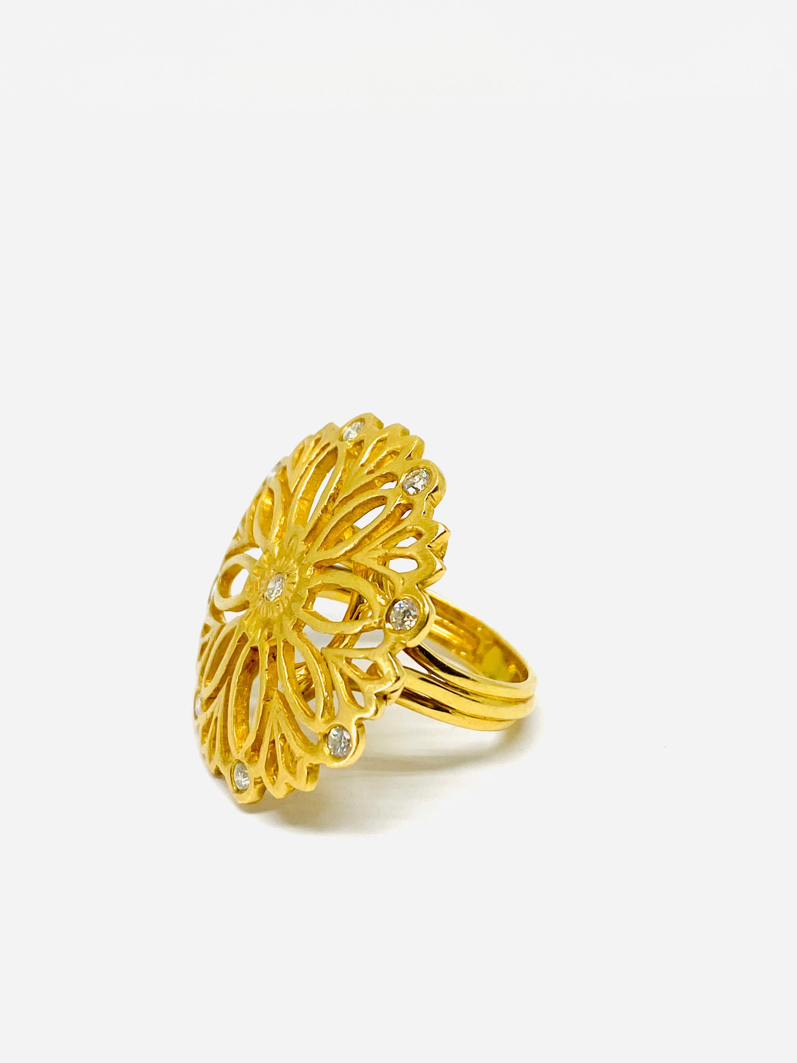 Suzanne Wilson 18K Yellow Gold and Diamond Florentine Finish Coctail Ring 

Product details:
750 18K yellow gold 
Round brilliant cut diamond 0.45ct
Ring size is 7.25
Total weight is 11.9 grams
Unsigned, but confirmed with the designer 