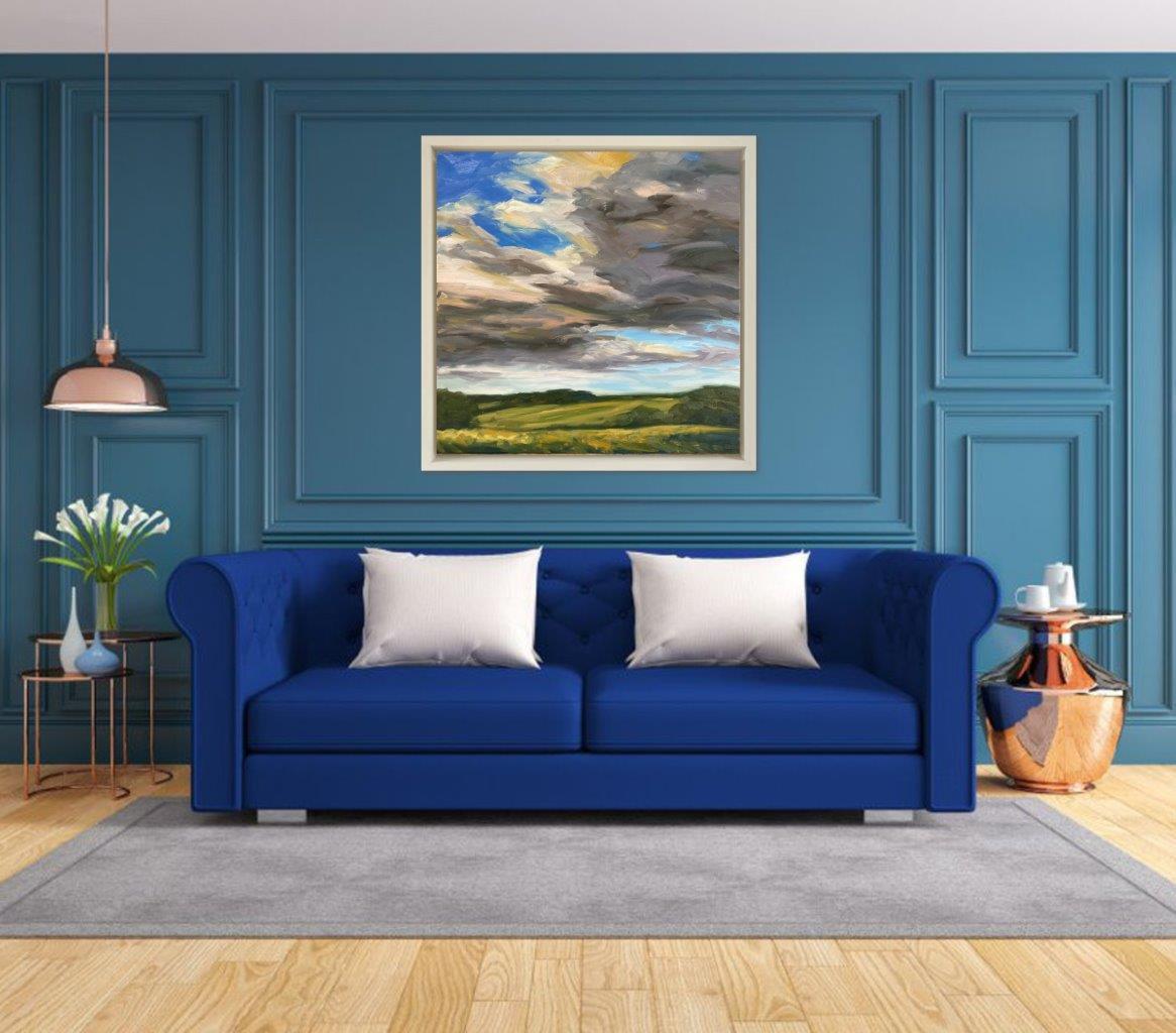 Bring the feeling of a fresh, bright summer’s day into your home. This painting focuses on the movement of big clouds rising up through a crisp blue sky over the summer fields around my home. Framed in a bespoke, hand-painted wooden