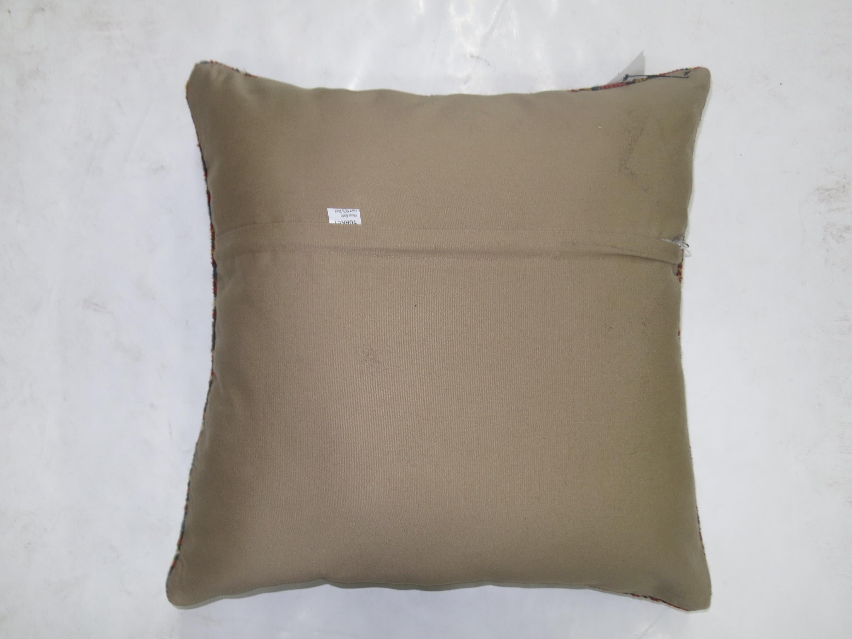 Indoor pillow made from a handmade embroidered Suzanni textile. Size 18'' x 18''.

 