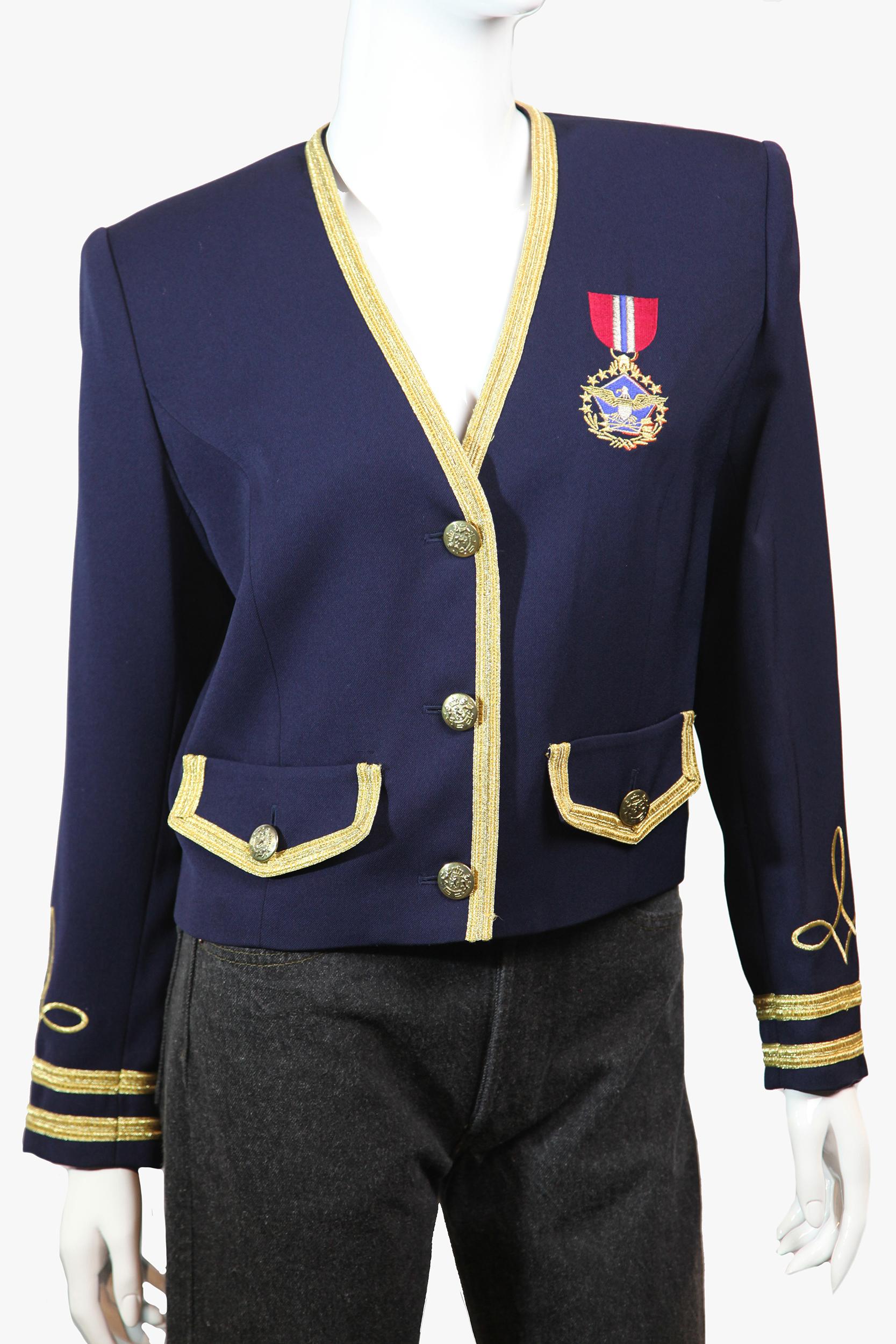 Vintage slightly cropped navy blue boxy v-neck blazer by Suzelle with military inspired details: gold braid, crest buttons, embroidered medal of honor at chest. 
Materials: Acetate, polyester
Size: 8
Length: 75 cm/ 29.5