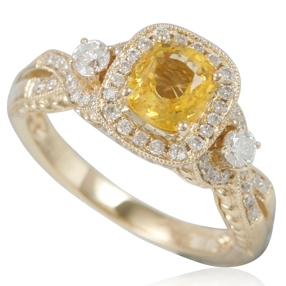 Add some radiant color and sparkle to your look with this stunning cocktail ring from Suzy Levian. This ring features a unique, cushion-cut yellow sapphire center stone and diamond accents that add personality to your ensemble. The yellow gold and