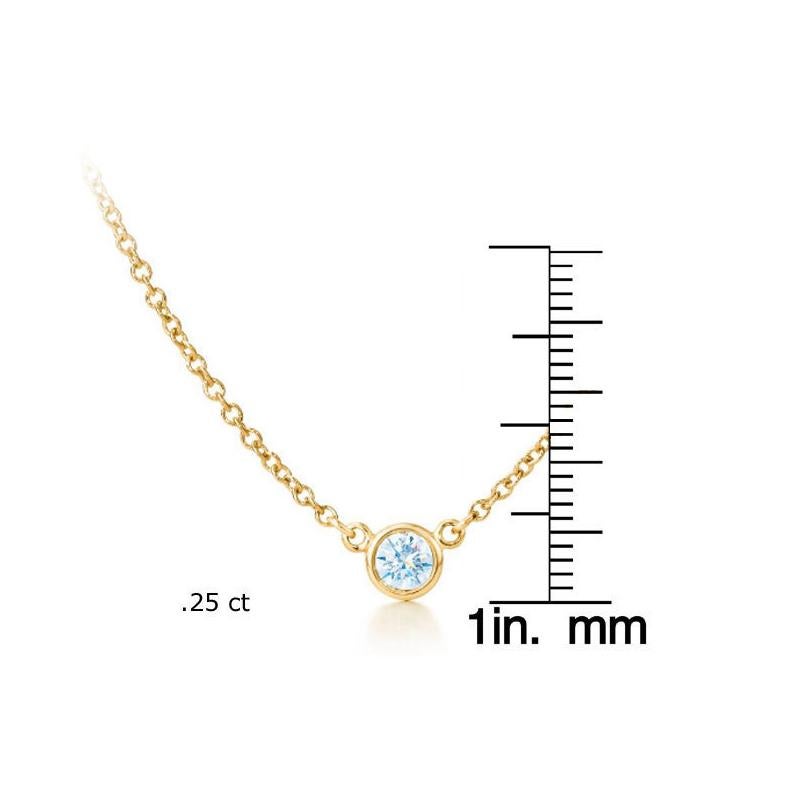 This magnificent pendant boasts a brilliant round-cut diamond in an exquisite bezel adorned of 14-karat yellow gold. The shimmering diamond gemstone is gloriously set in its bezel pendant. This gorgeous necklace features a 18 inch cable chain with a