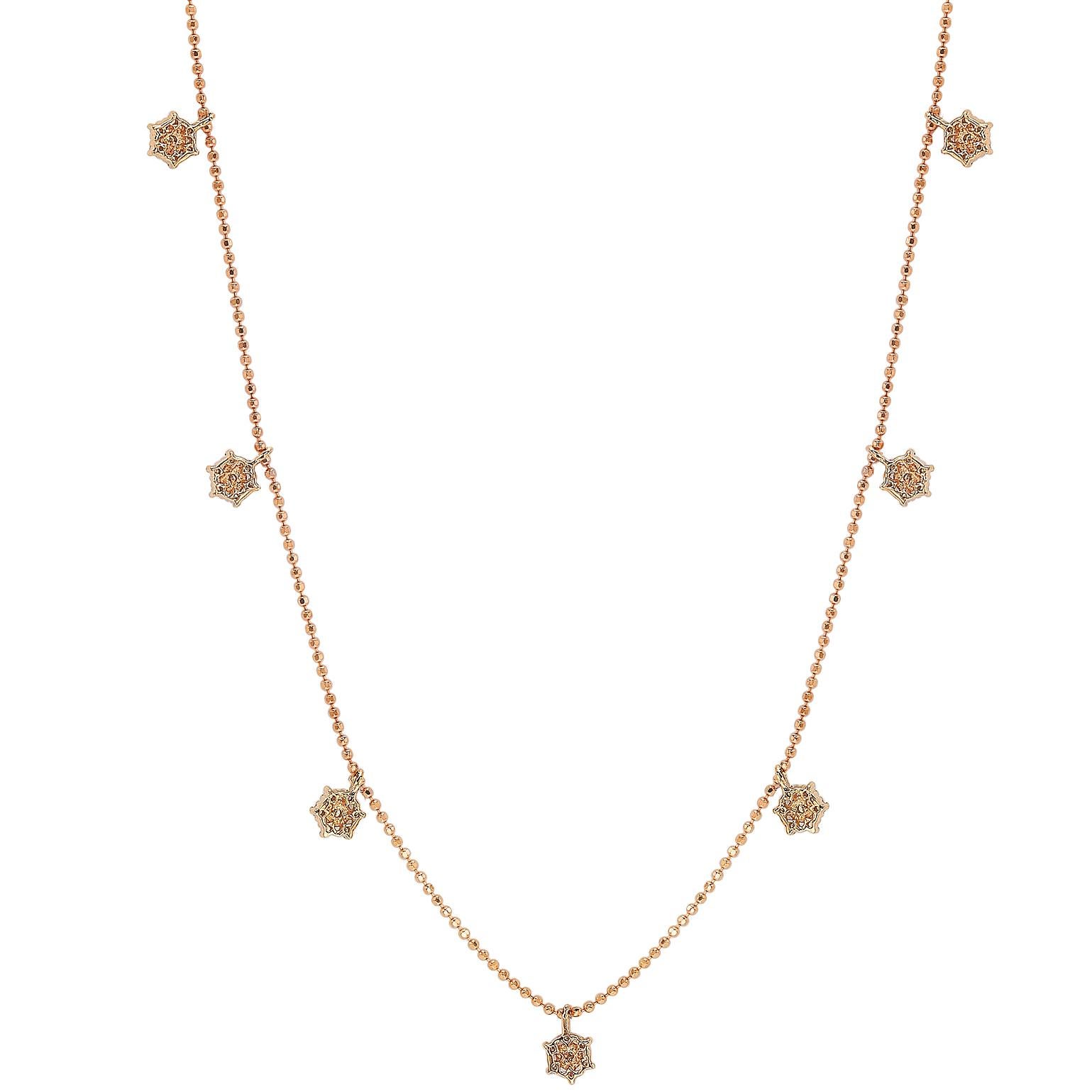 This unique Suzy Levian diamond station flower necklace displays round-cut diamonds on 14 karat rose gold setting. This gorgeous necklace contains 49 white round cut diamonds totaling .30cttw. The necklace has 7 flower, each flower contains 7