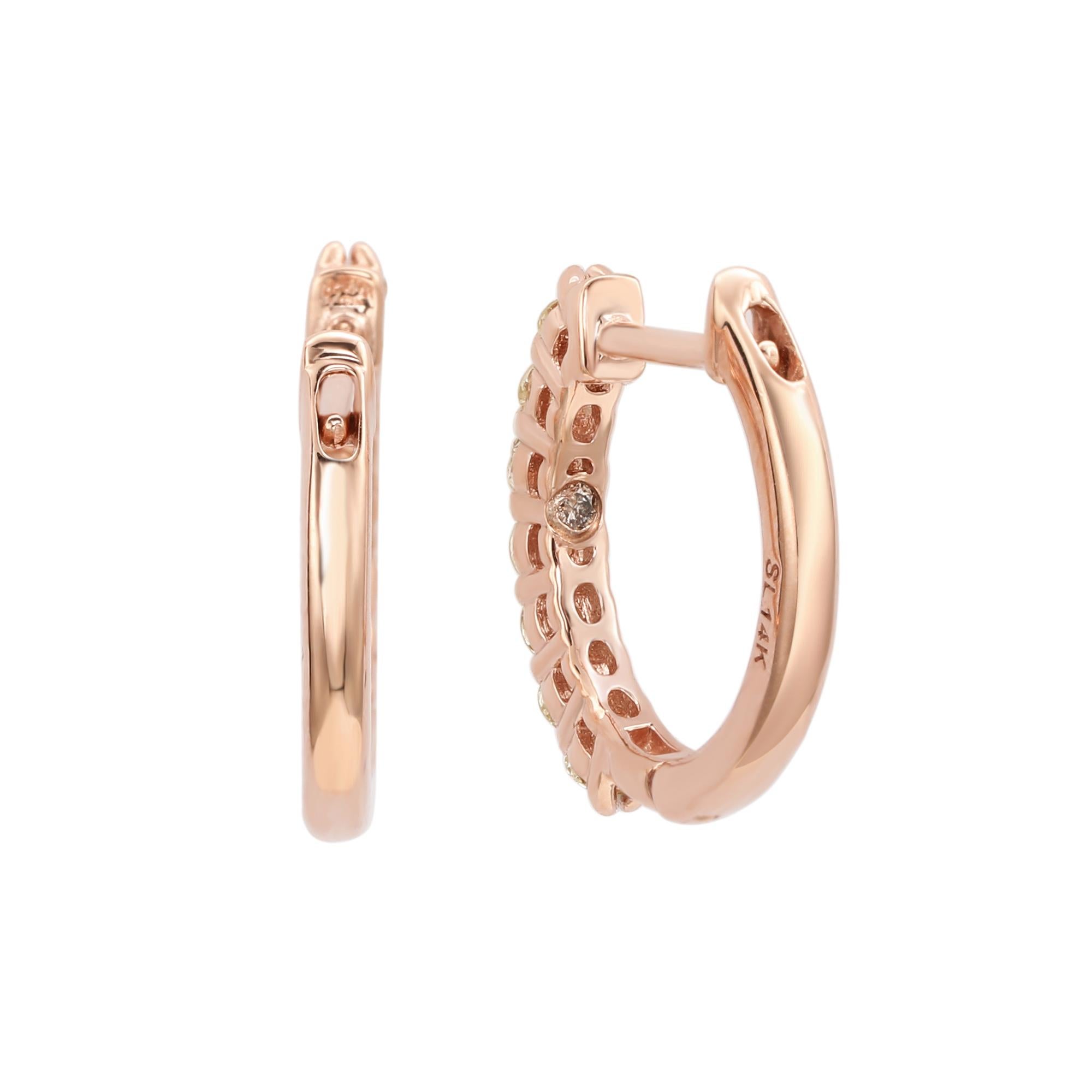 Make a statement with stunning huggie hoop earrings, perfect for women of all ages. These huggie hoop earrings feature a single row of round cut white diamonds set in 14k rose gold. These hoops are crafted of sparkling diamonds going down the outer