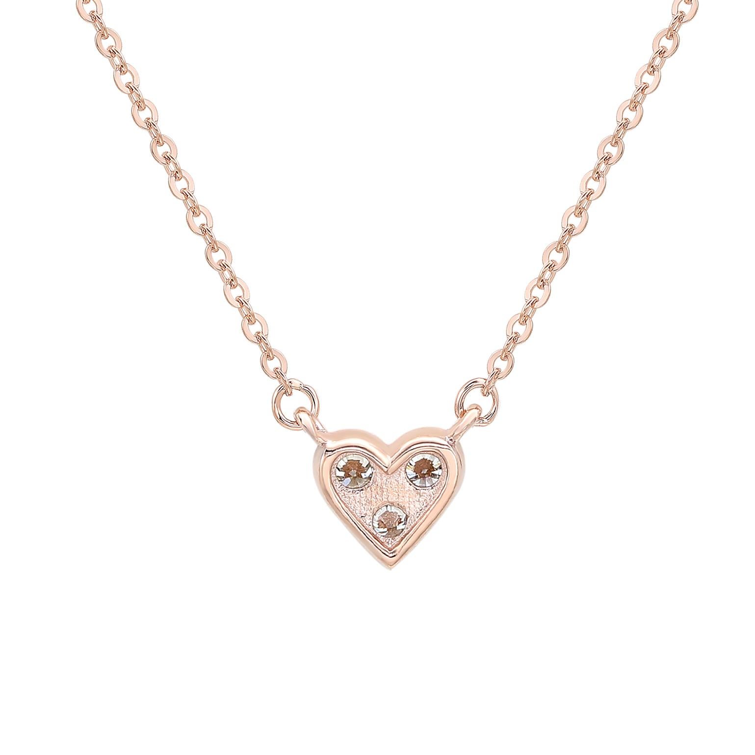 Add an elegant accent to your outfit with this sparkling Suzy Levian heart shape necklace featuring 3 round cut gorgeous white diamonds in a prong setting. The sparkling diamonds are hand set in 14-karat rose gold, and weigh 0.18 cttw and are g-h,