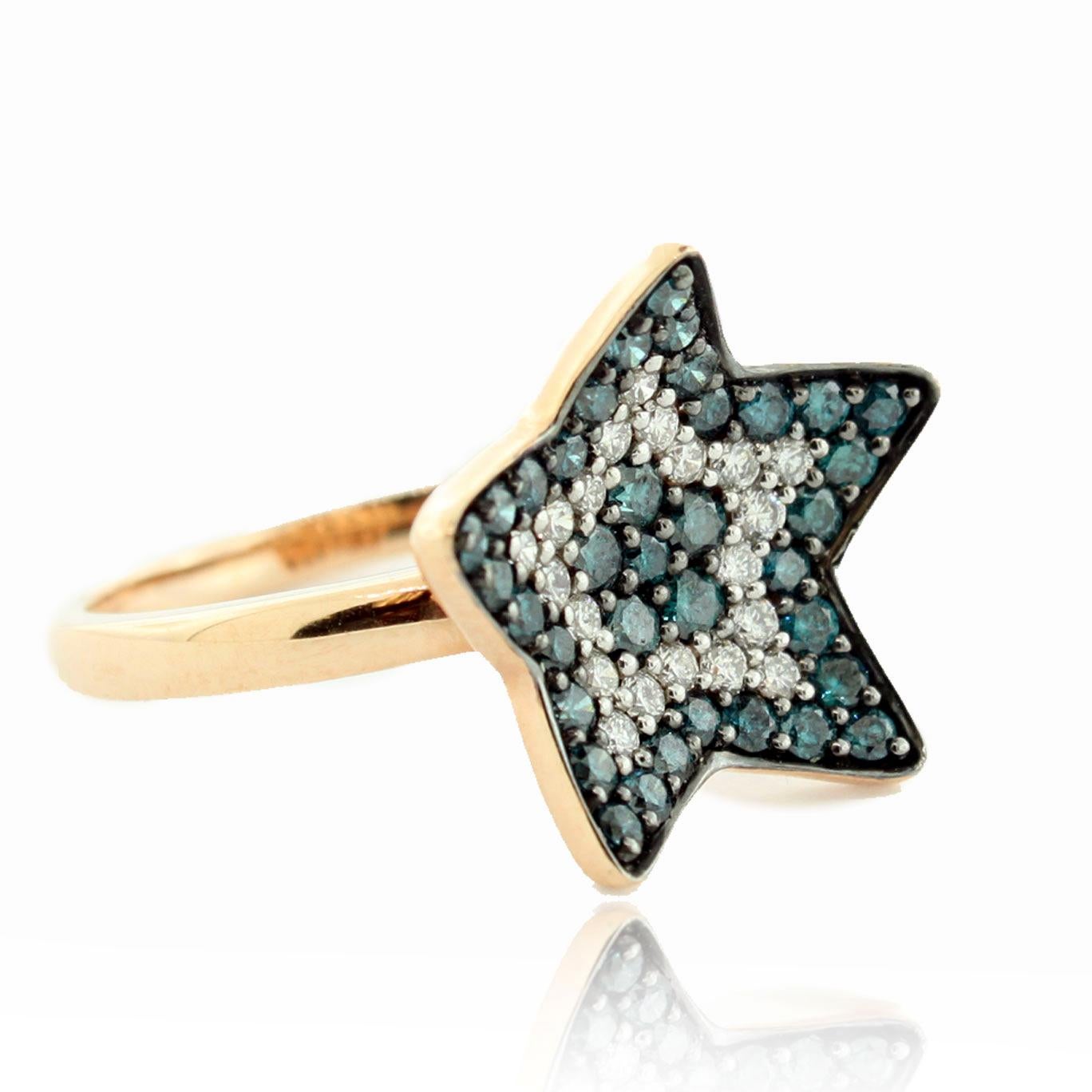 This spectacular star shaped ring from the Suzy Levian Limited Edition collection is set in 14k rose gold shank. Alternating rows of blue and white diamonds (1.02cttw) creates a perfect star design for only the classiest of women. The brilliance of