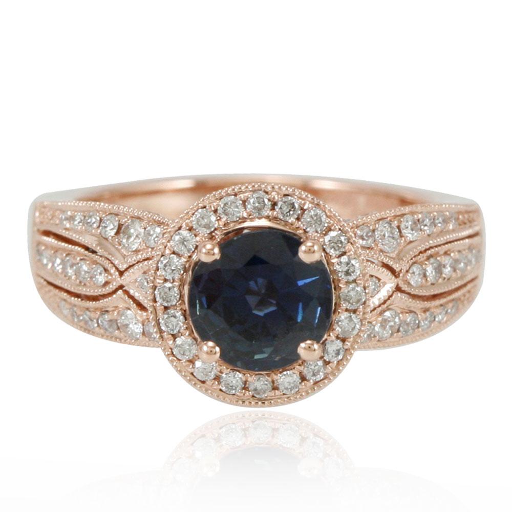 This spectacular ring from the Suzy Levian Limited Edition collection features a kanchanaburi sapphire gemstone held in a 14K rose gold prong setting. An array of side white diamonds (.93ct) with hand-carved French filigree work across the band,