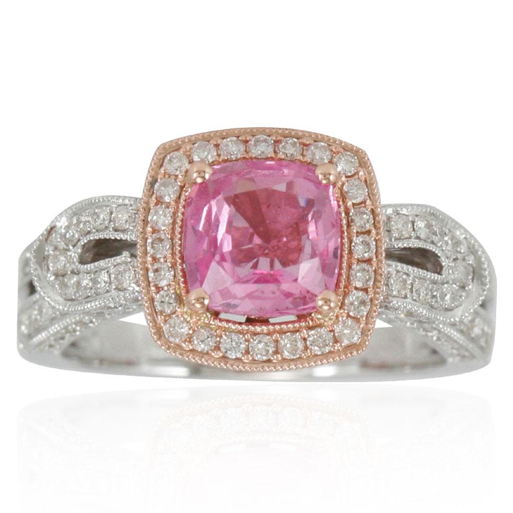 Elegance is the word that comes to mind seeing this limited edition, Suzy Levian cocktail ring. The cushion-cut pink ceylon sapphire (2.09ct) center stone is adorned by 134 round-cut white diamonds. These shimmering diamonds (.83TDW) enhance the