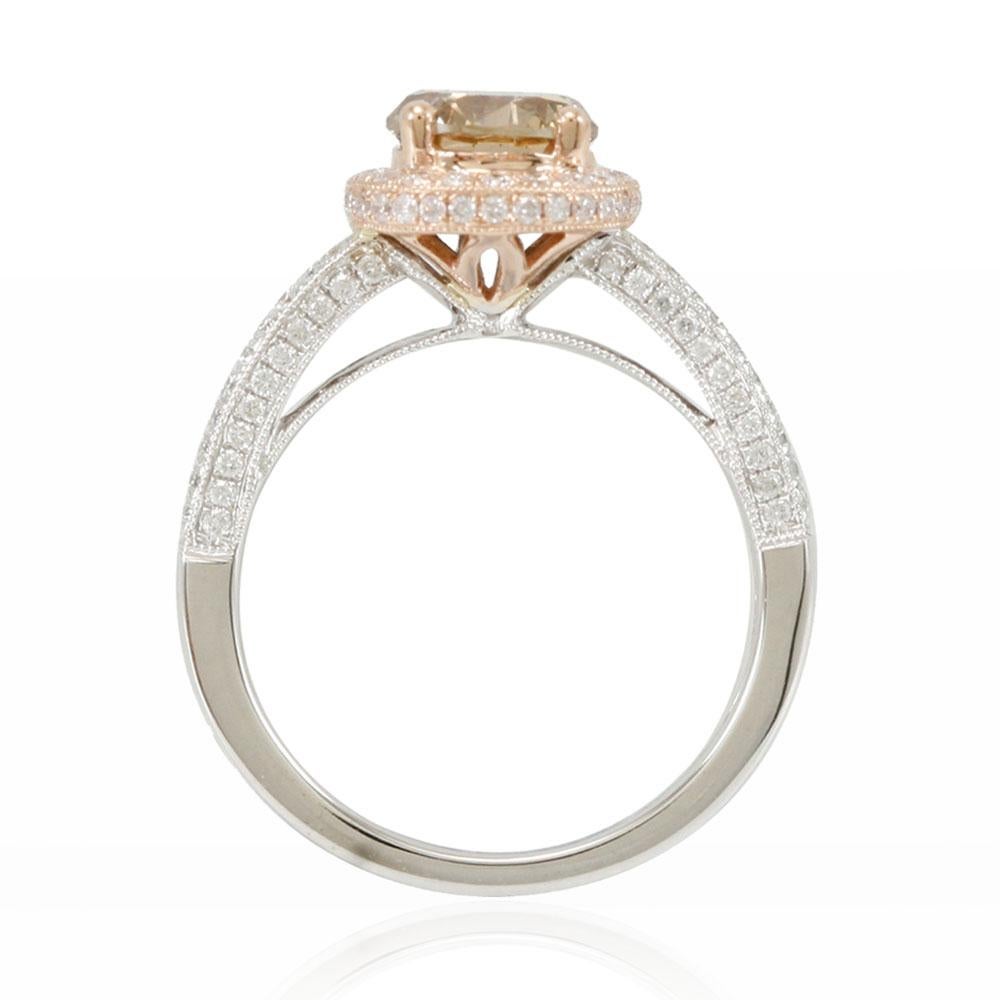 It's a taste you can see. This stunning ring from the Suzy Levian Limited Edition collection features a gorgeous round-cut, brown diamond (1.54ct) center stone with an array of white diamond (.63cttw) accents, handset in a 14k two-tone white and