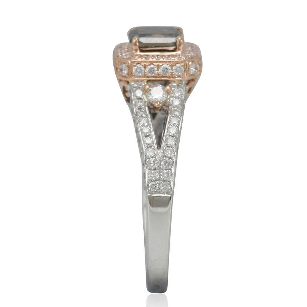 This stunning ring from the Suzy Levian Limited Edition collection features a gorgeous Ascher-cut, forest green diamond (1.05ct) center stone with an array of white diamond (.69cttw) accents, handset in a 14k two-tone white and rose gold setting.