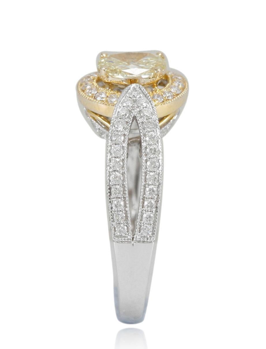 This delicious ring from the Suzy Levian Limited Edition collection features a yellow diamond center stone (.64 ct) in a 14k two-tone white and yellow gold setting. An array of white diamonds (1.00cttw) accent the perfect two-tone style of the ring.