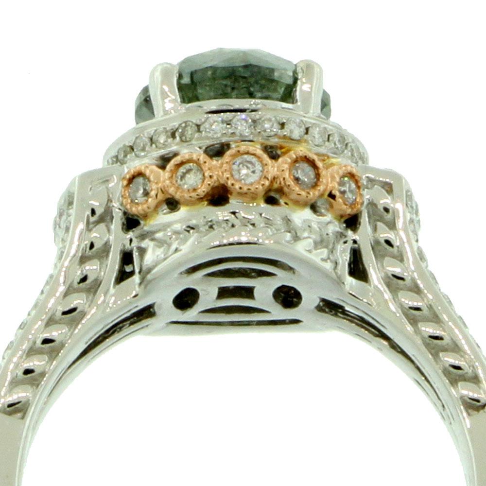 A rich green diamond is prong-set atop this beautiful ring, surrounded by a halo of sparkling white diamonds. Yellow gold is plated across the shank for a beautiful two-tone design over this 14k gold ring.

Center stone
Diamonds: One
Center cut: