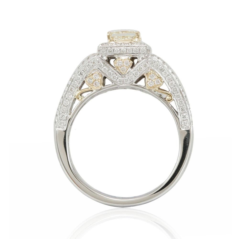 This spectacular ring from the Suzy Levian bridal collection features 14k two-tone white and yellow gold. An array of pave white diamonds (.80cttw) accent the band as a square-cut, natural fancy yellow radiant cut diamond center stone (.69ct) is