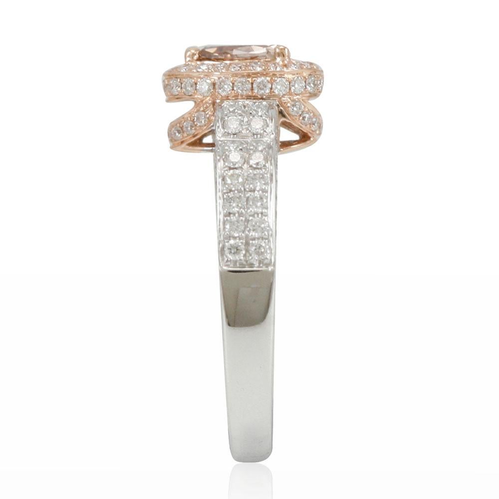 This spectacular ring from the Suzy Levian collection features a fancy brown diamond pear-shape center stone (.40cttw) with an an array of (G-H; SI1-2) white diamond accents (.69cttw), beautifully crafted in 14k two-tone white and rose gold. The