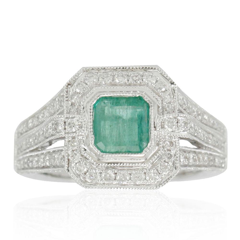 This spectacular ring from the Suzy Levian Limited Edition collection features a Colombian emerald gemstone held in a 14K white gold basket setting. An array of side white diamonds (1.13ct) with hand-carved French filigree work across the band,