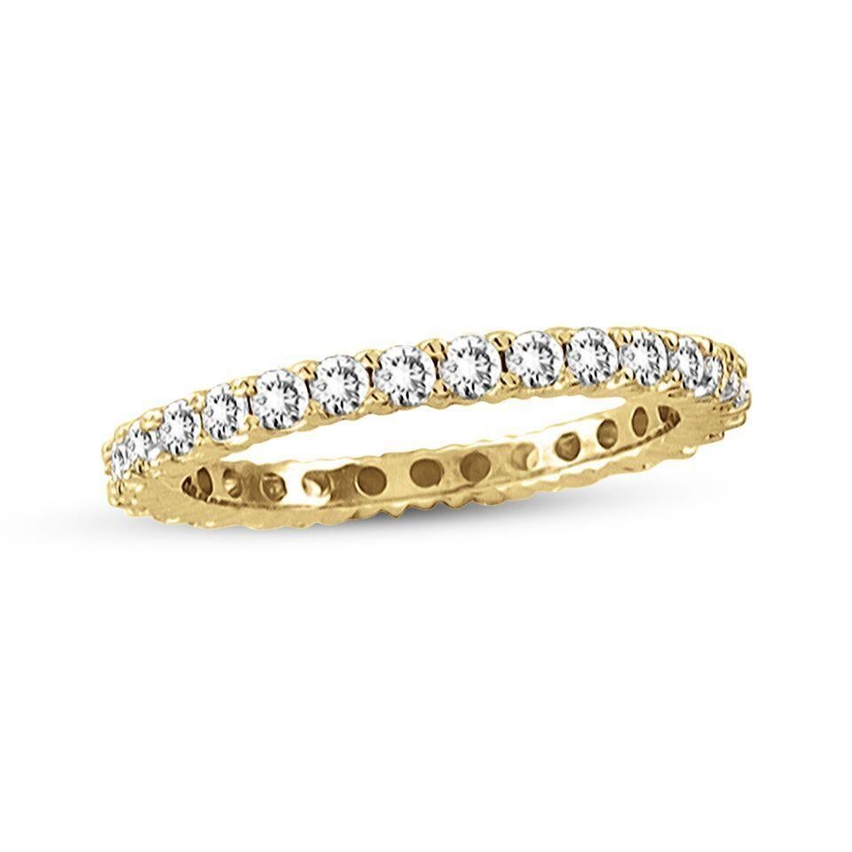 Radiant round-cut diamonds sparkle along the entire band of this wedding band ring, lending dazzle to your reminder of commitment. Designed by Suzy Levian, this 14k yellow gold eternity ring features a high polish finish. Adorn your hand or the hand