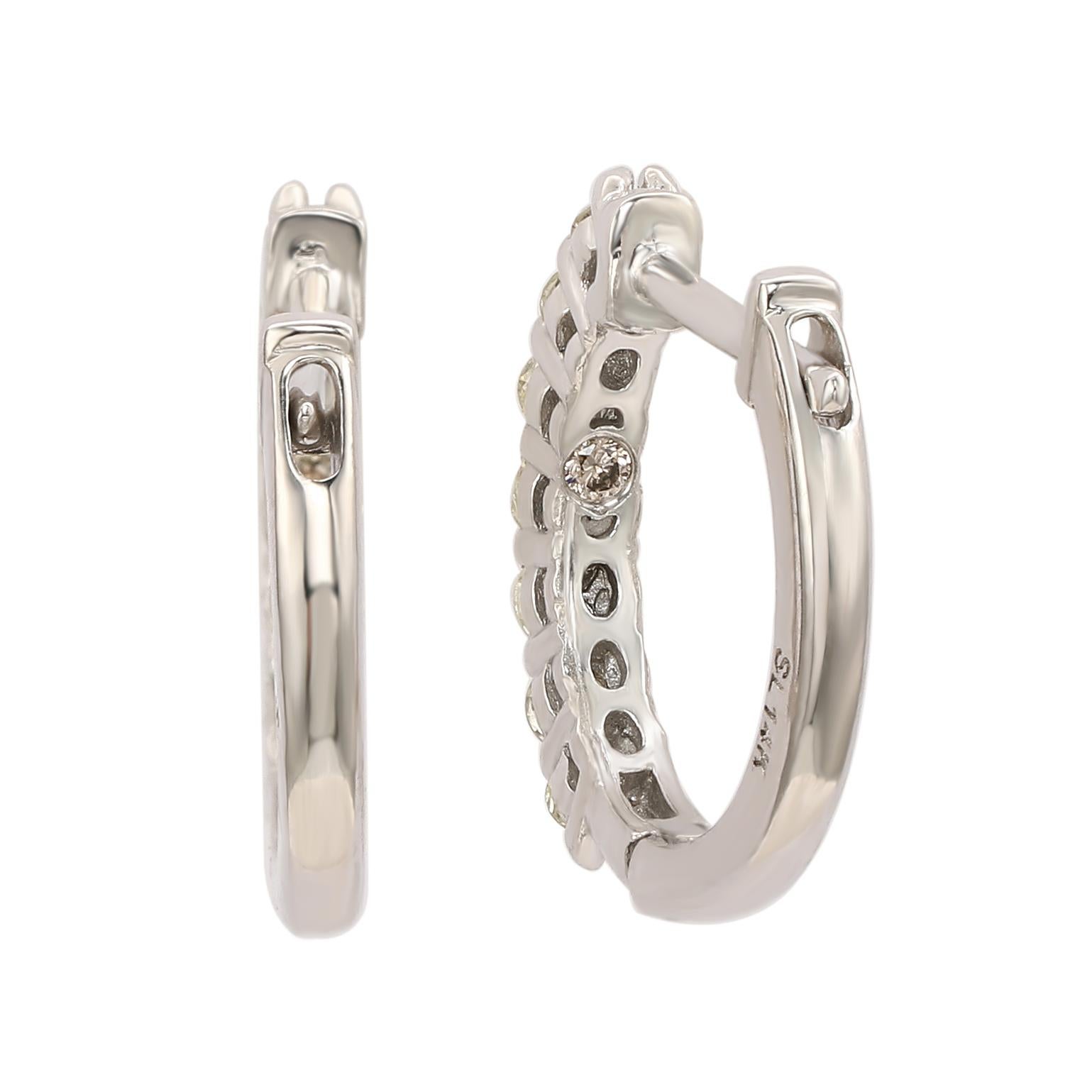 Make a statement with stunning huggie hoop earrings, perfect for women of all ages. These huggie hoop earrings feature a single row of round cut white diamonds set in 14k white gold. These hoops are crafted of sparkling diamonds going down the outer