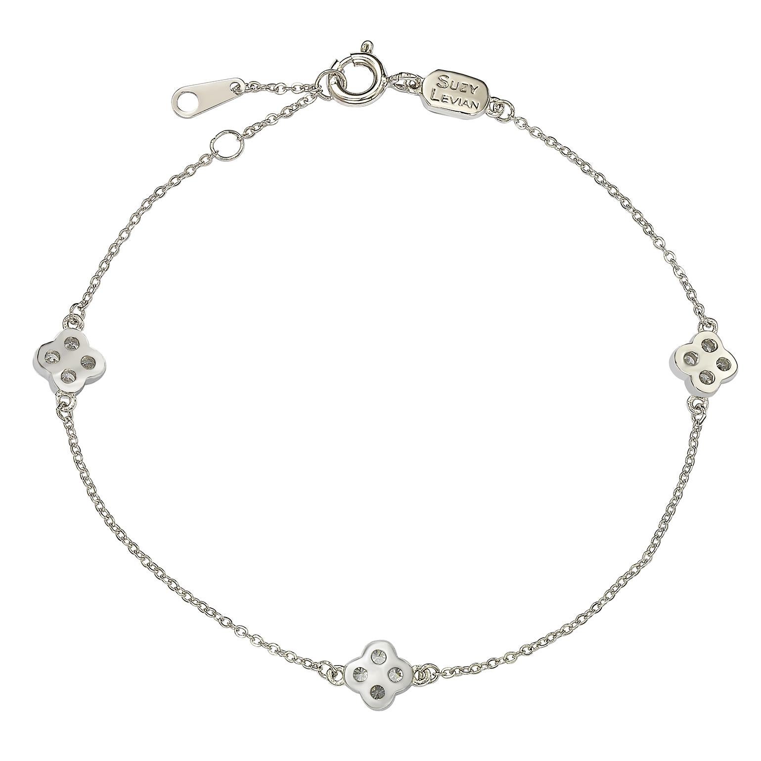 This elegant Suzy Levian by the yard clover bracelet features, 1.75 mm size diamond stones which are each .02 tw, which totals .24 cttw, all set in 14K white gold setting. There are 3  clover attached to chain , that is secured with a spring ring