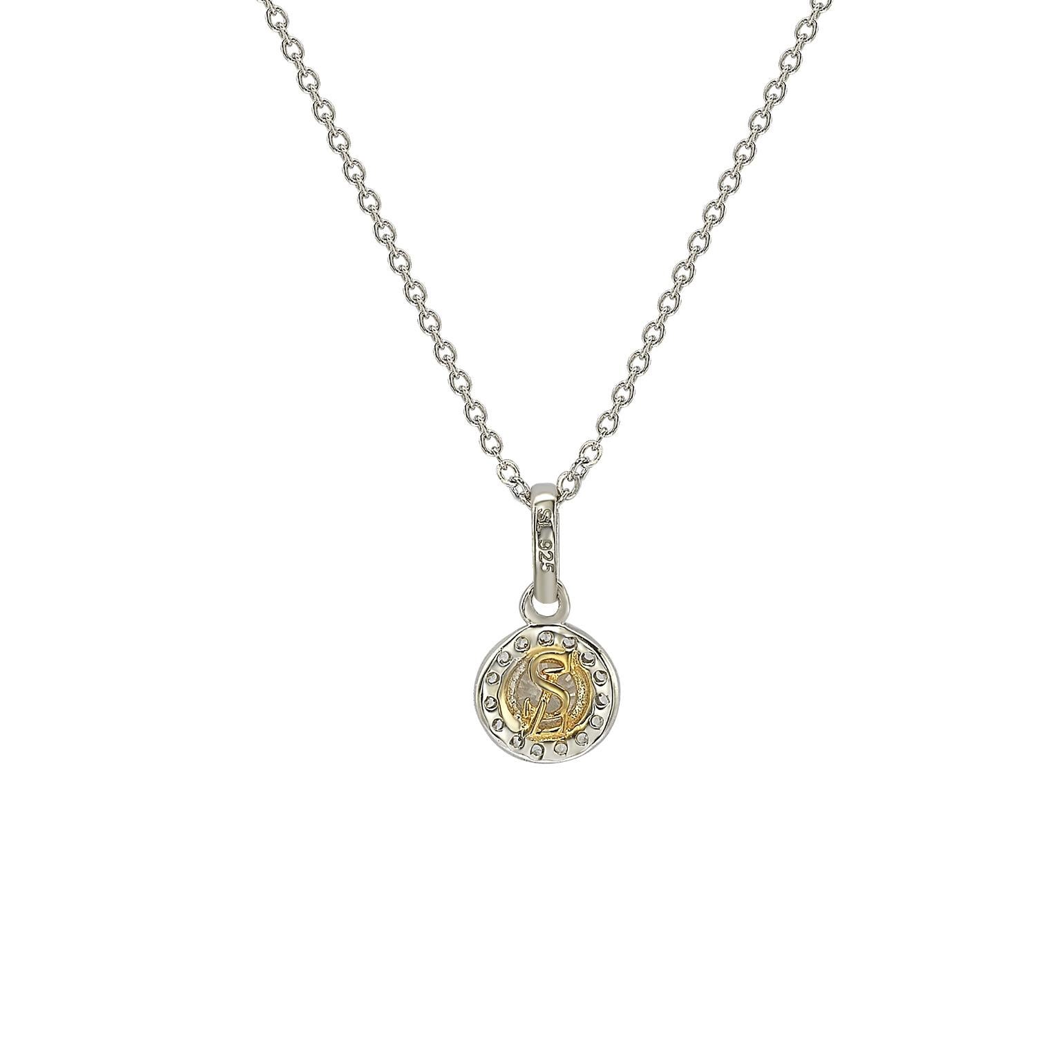 This elegant Suzy Levian diamond halo pendant displays round-cut diamonds on 14 karat white gold setting. This gorgeous pendant contains 20 white round cut diamonds totaling .35 cttw. The larger center stone is 4 mm in size and has a halo of 1 mm