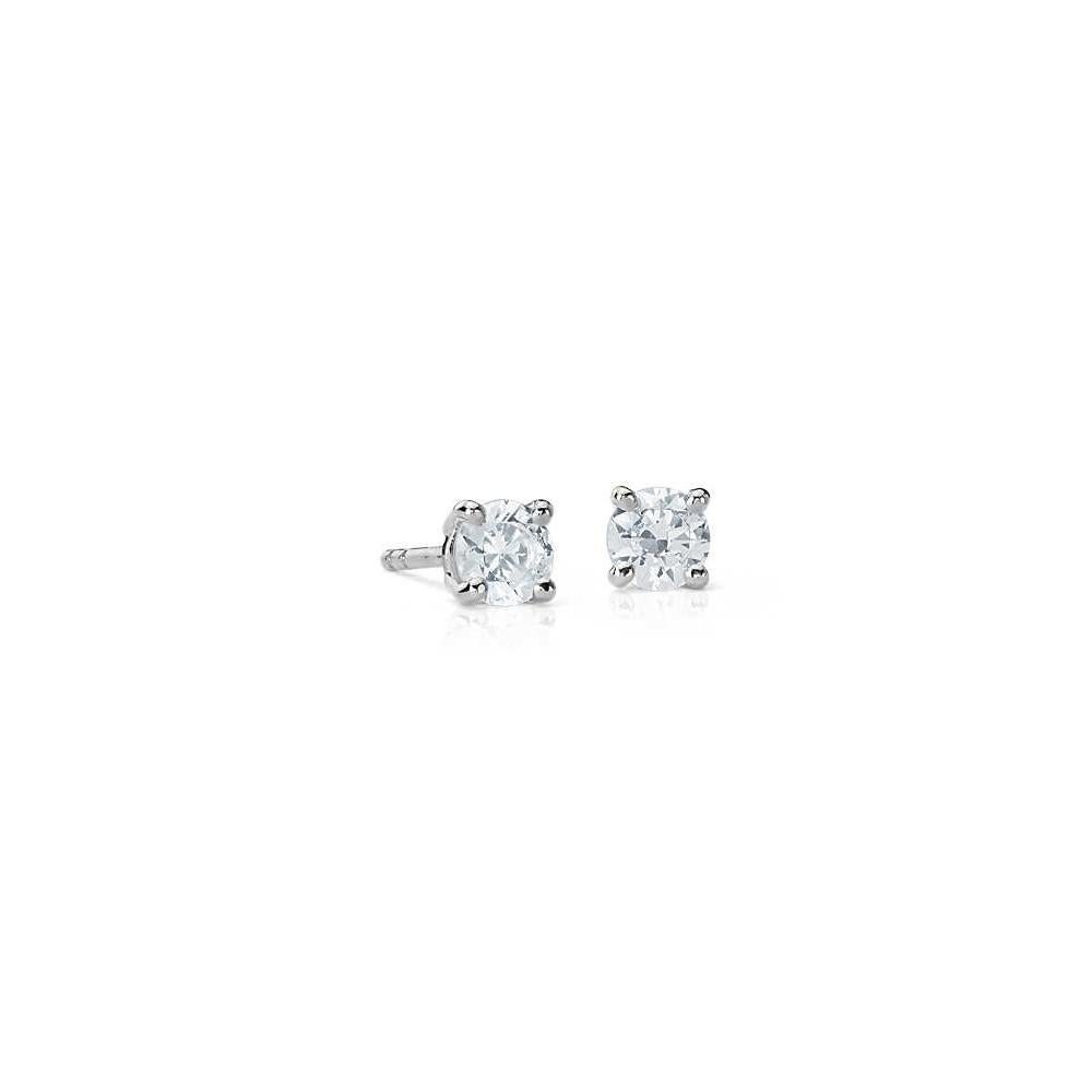 Add an elegant accent to your outfit with these sparkling stud earrings featuring two gorgeous white diamonds in a prong setting. Crafted in 14-karat white gold, these earrings have a high polish finish and butterfly clasp.

White Diamonds:
2