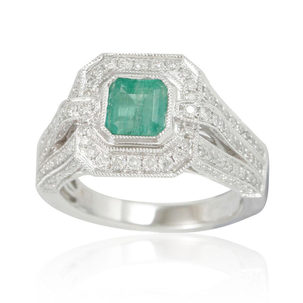 This spectacular ring from the Suzy Levian Limited Edition collection features a Colombian emerald gemstone held in a 14K white gold basket setting. An array of side white diamonds (1.13ct) with hand-carved French filigree work across the band,