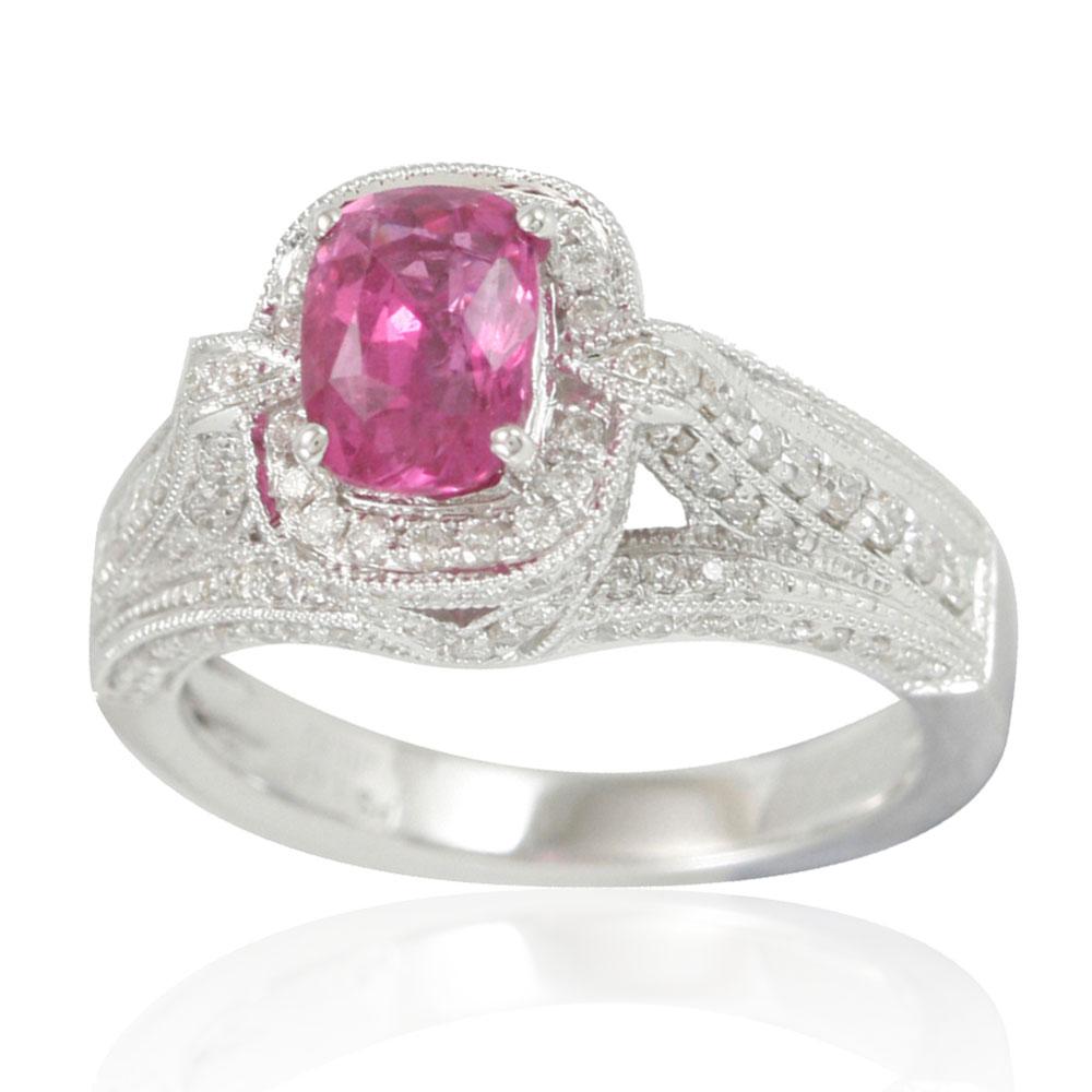 Add a pop of color to your finger using this pink ceylon sapphire ring from the Suzy Levian. The elongated-cushion cut pink sapphire center stands out as it is highlighted by 78 surrounding round white diamonds(.82TDW). This one-of-a kind ring,