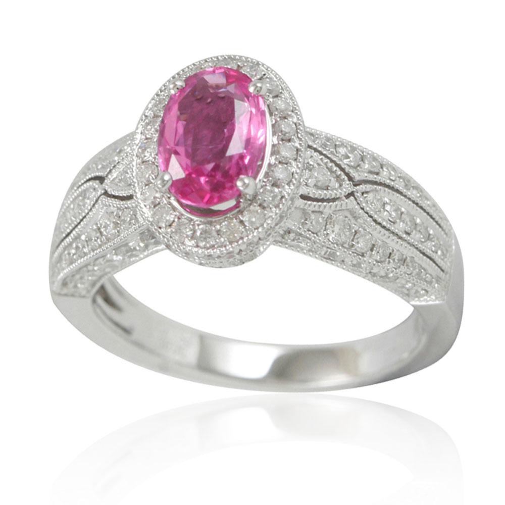 This spectacular cocktail cluster style ring from the Suzy Levian limited edition collection features a large ceylon pink sapphire center held in a 14K white gold prong setting. An array of 125 smaller white diamonds (.92TDW) with hand-carved French