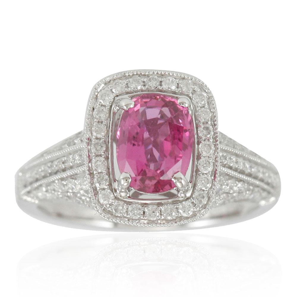 This Suzy Levian ring is an exclusive, limited edition 2.37cttw Pink Ceylon Sapphire and Diamond ring. The vibrant pink of this ring's sapphire elongated cushion-cut center stone makes your skin seem to glow with health. The pink sapphire (1.47ct)