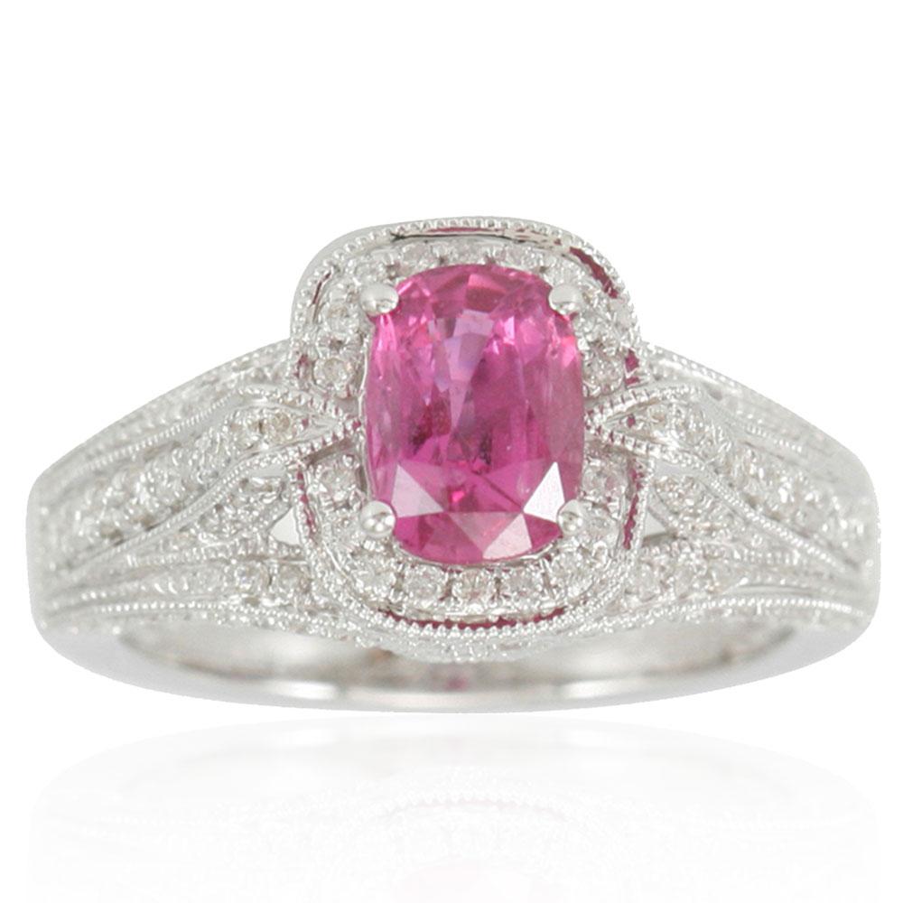 Add a pop of color to your finger with this pink ceylon sapphire ring by Suzy Levian. The elongated-cushion cut pink sapphire center stands out as it is highlighted by 78 surrounding round white diamonds. This one-of-a kind ring, crafted of 14K