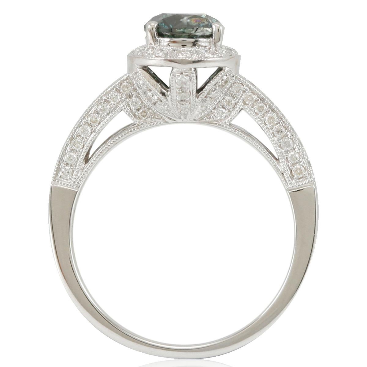 Watch her eyes light up with joy when you present her with this dazzling blue-green and white diamond ring from Suzy Levian. A graceful array of white diamonds .51ct highlight the vivid beauty of a single round-cut blue-green diamond 1.17 with