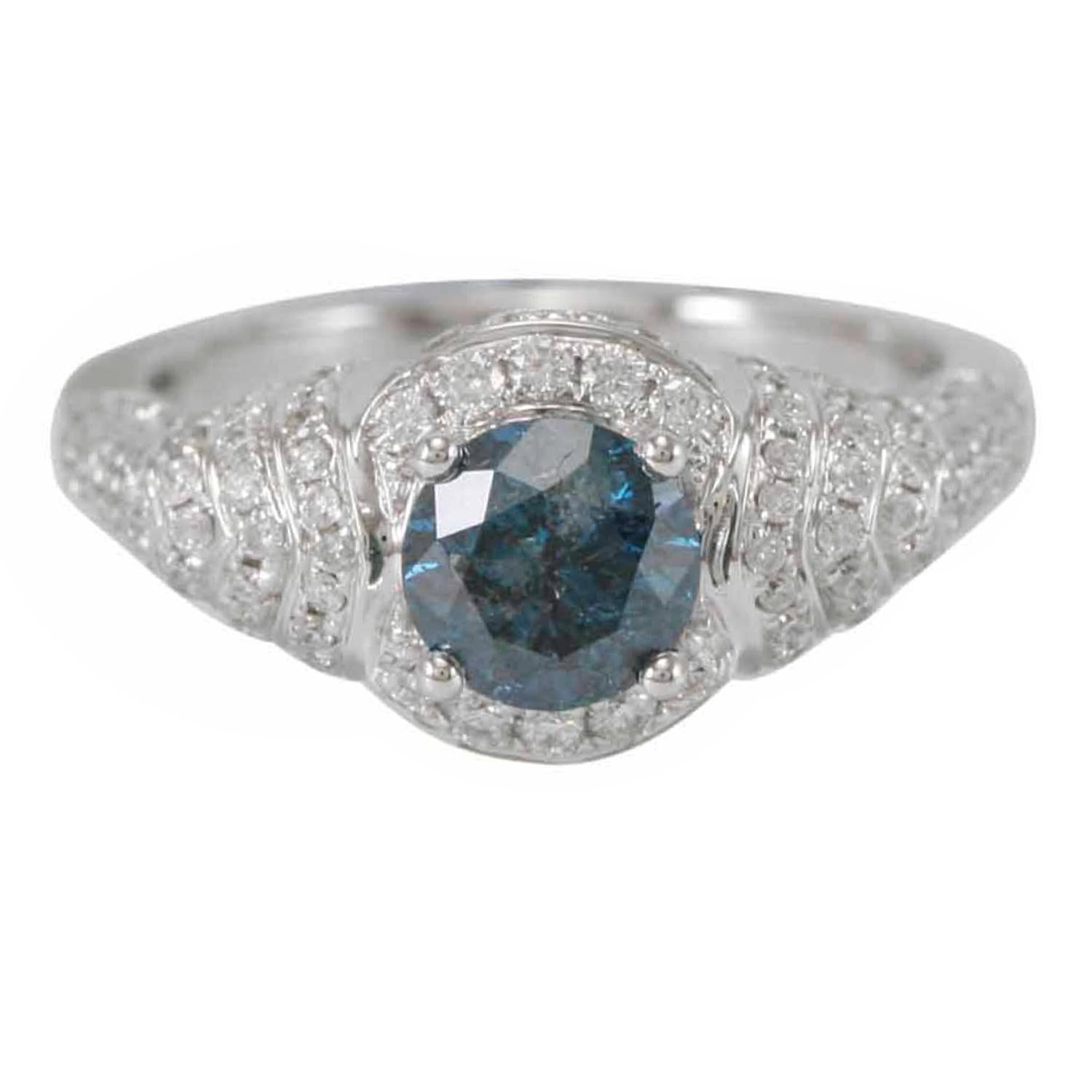 This stunning, one-of-a-kind ring from the Suzy Levian Limited Edition collection features a gorgeous round-cut, blue diamond (1.00ct) center stone with an array of white diamond (.79cttw) accents, handset in a 14k white gold setting. French