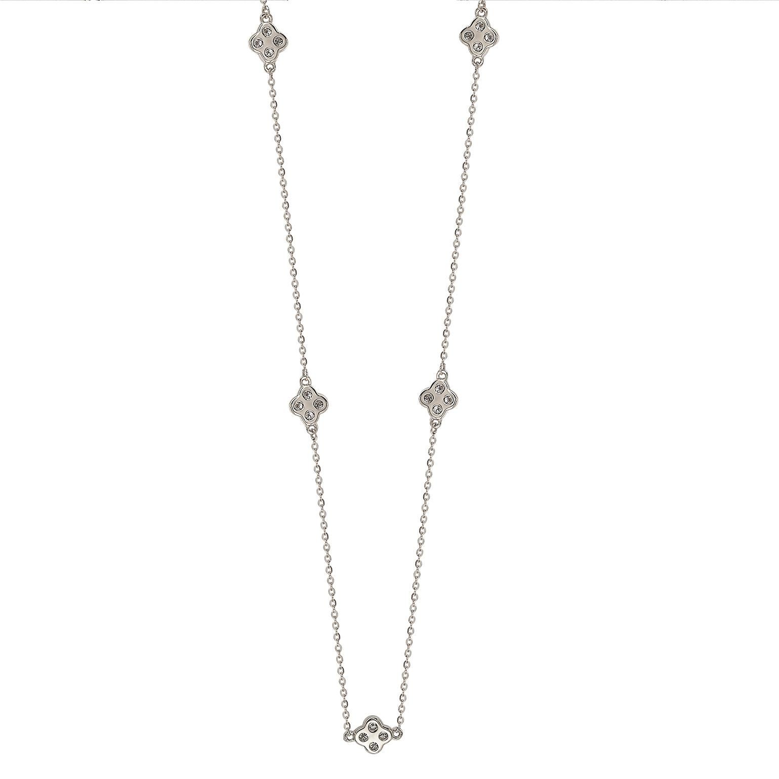 This unique Suzy Levian diamond clover by the yard necklace displays round-cut diamonds on 14 karat white gold setting. This gorgeous necklace contains 20, 1.75 mm white round cut diamonds totaling .40 cttw. The necklace has 7 clovers, each clover