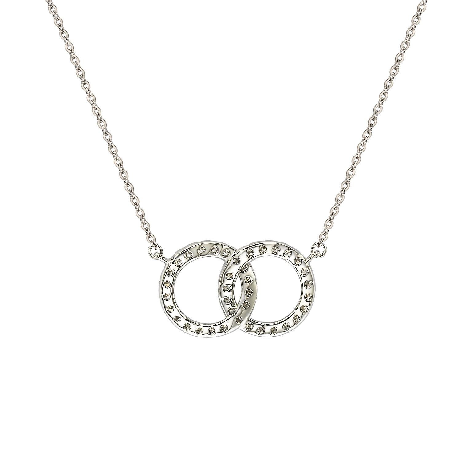 This elegant Suzy Levian solitaire interlocking circle necklace displays round-cut diamonds on 14 karat white gold setting. This gorgeous interlocking circle necklace has 38, 1.4 mm, white round cut diamonds totaling .48 cttw. This interlocking